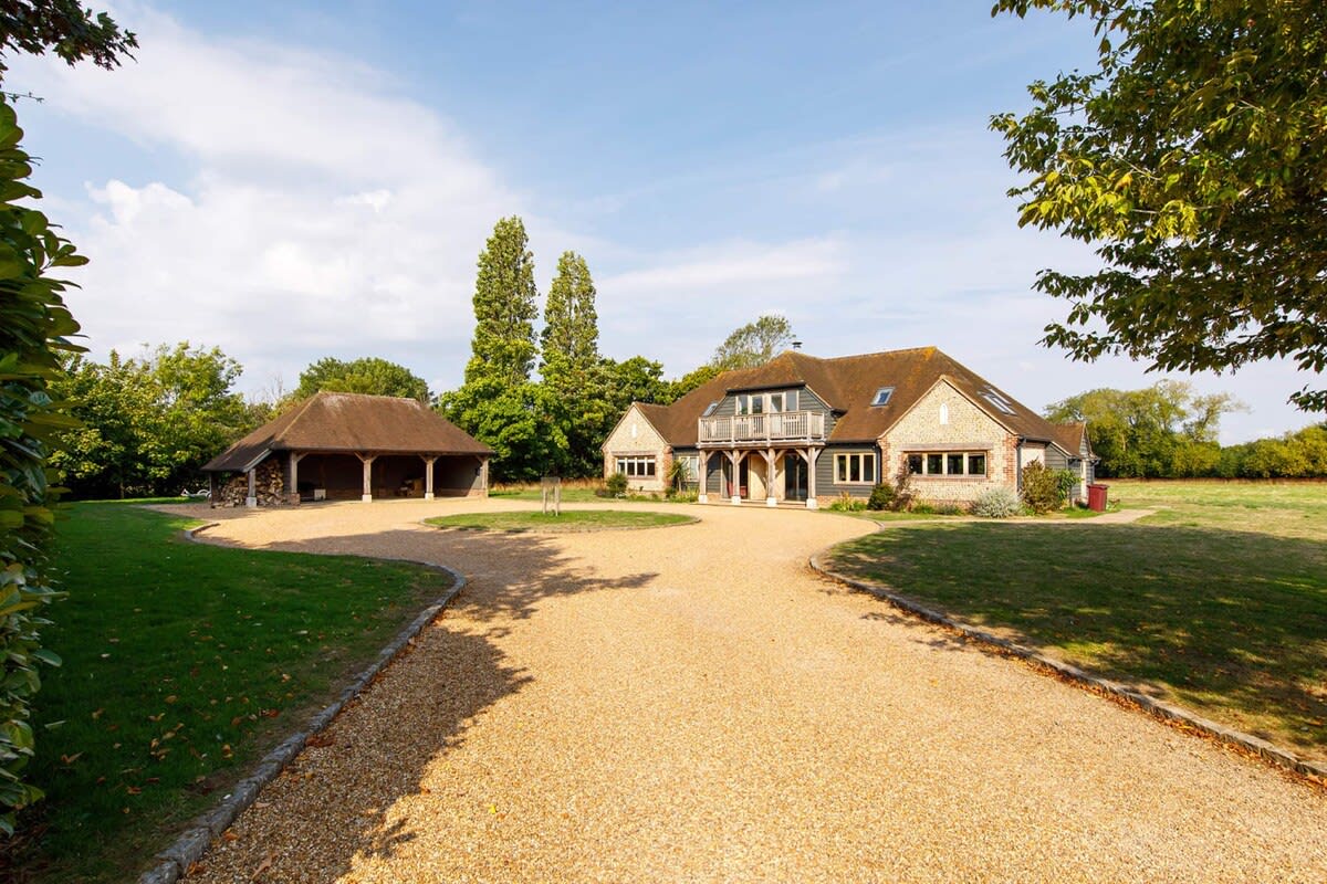 The large driveway and car port offers ample parking.