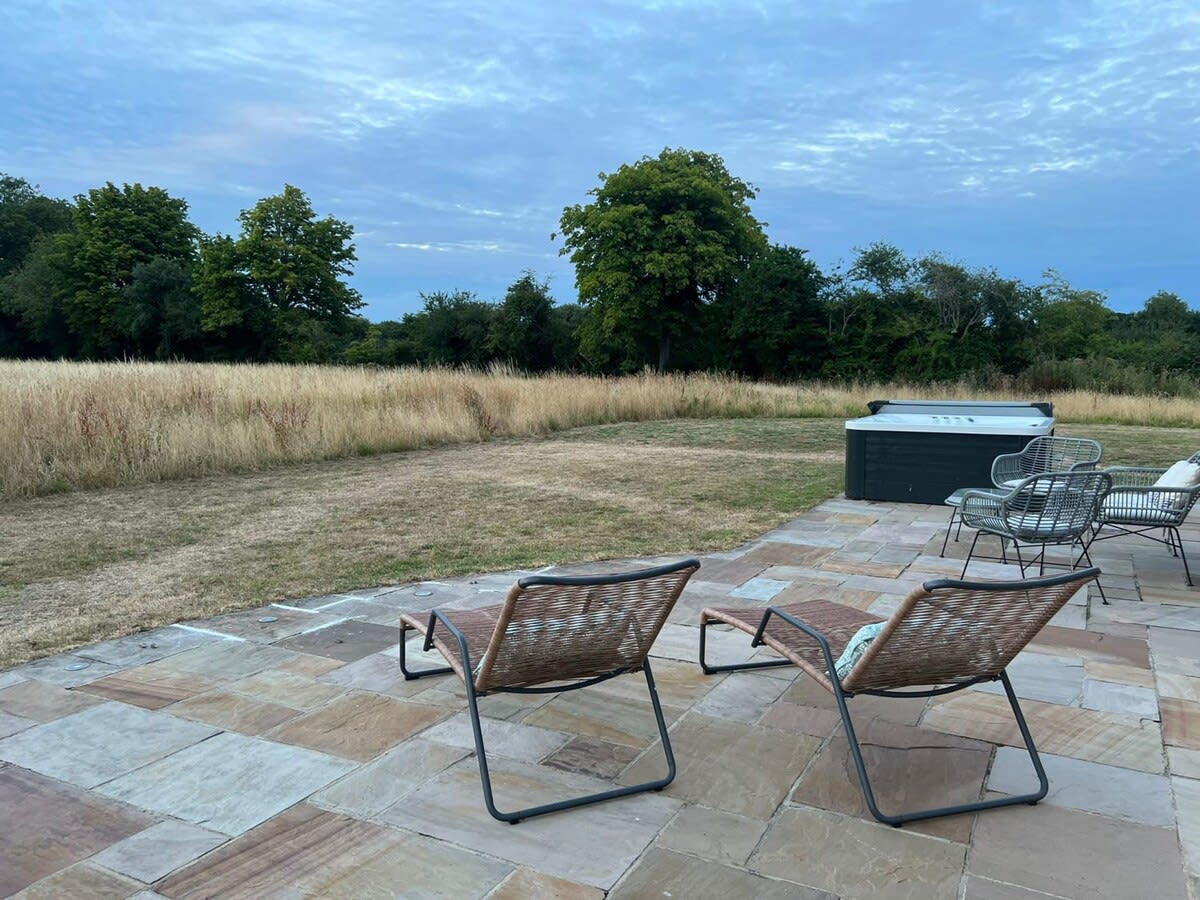Relax and unwind in the beautiful garden, complete with hot tub, seating and sun loungers.