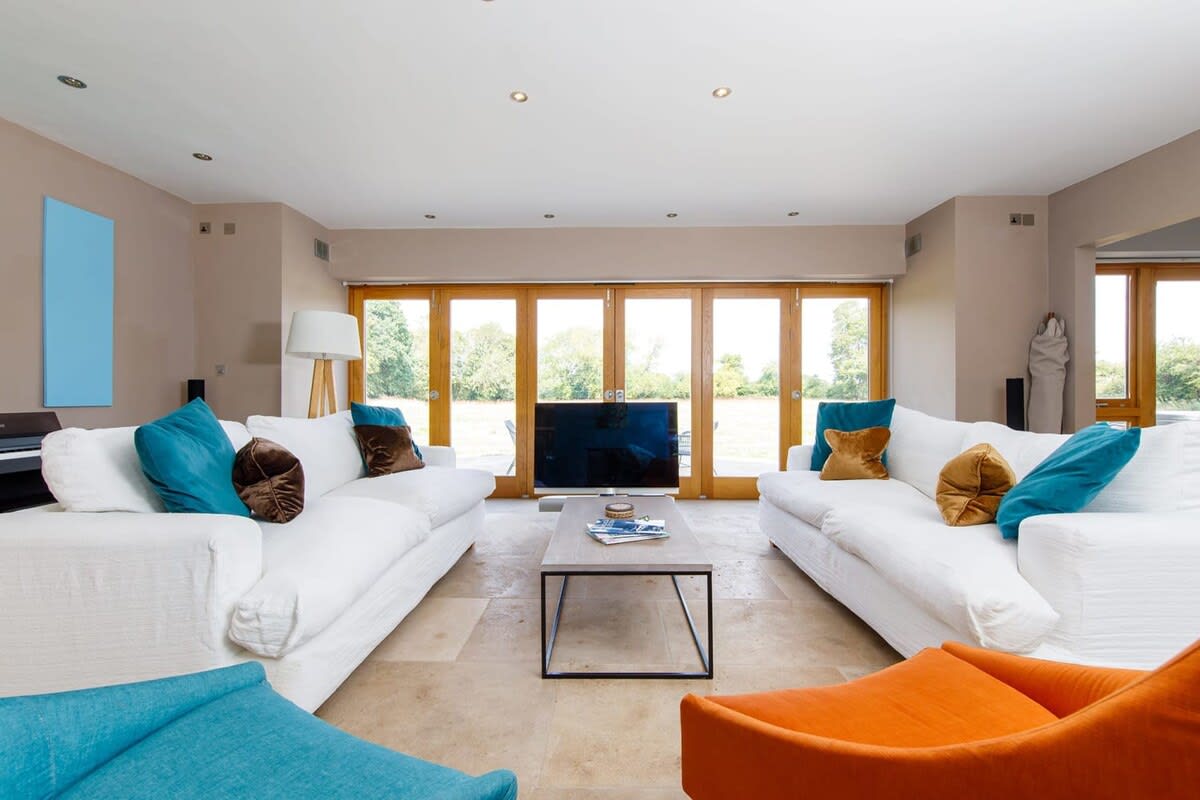 Relax and unwind in the spacious lounge area and enjoy views out to lush green surroundings.