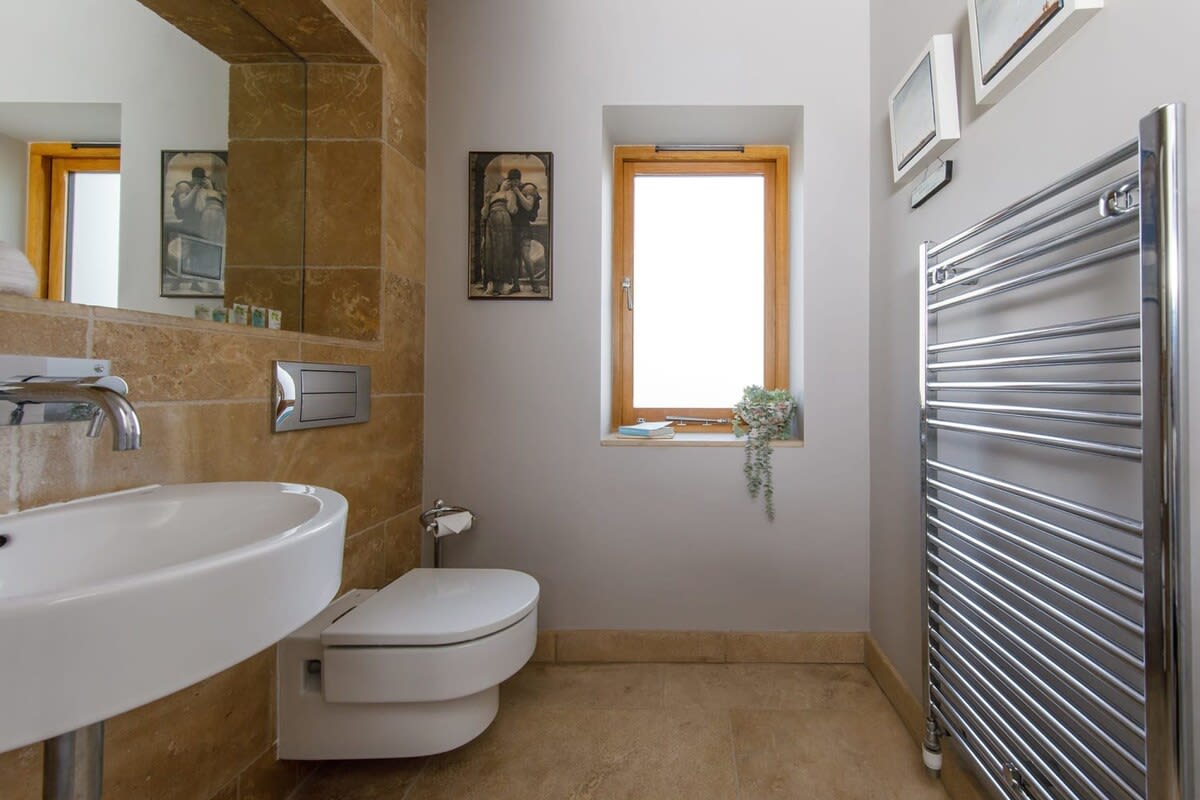 There is a handy downstairs cloakroom.