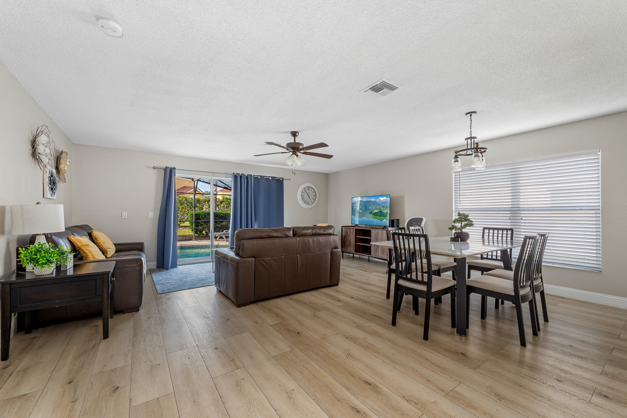 Open living & dining space w/ airy layout and coordinated furnishings.