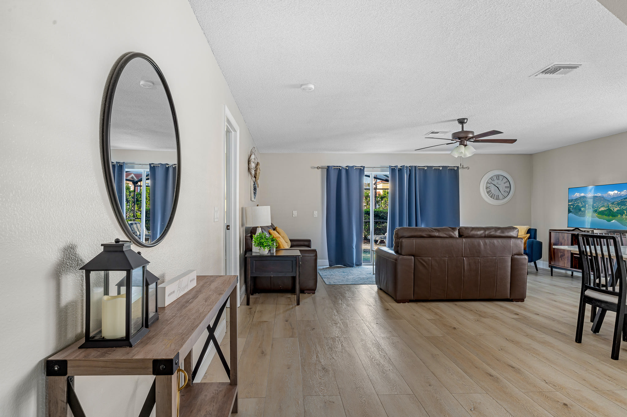 Open living & dining space w/ airy layout and coordinated furnishings.