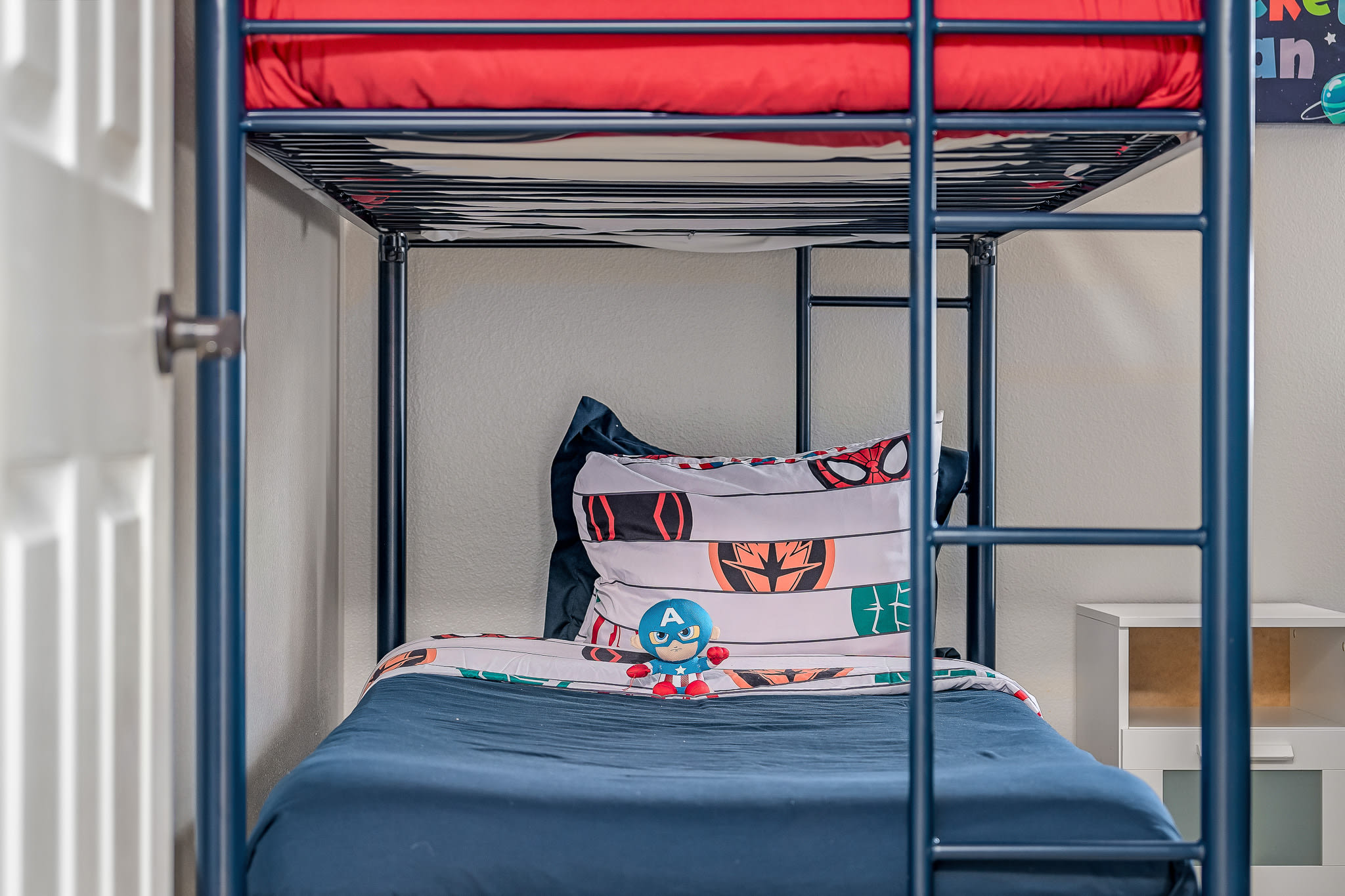Bunk room w/ bright colors and a fun, sleepover-ready setup.