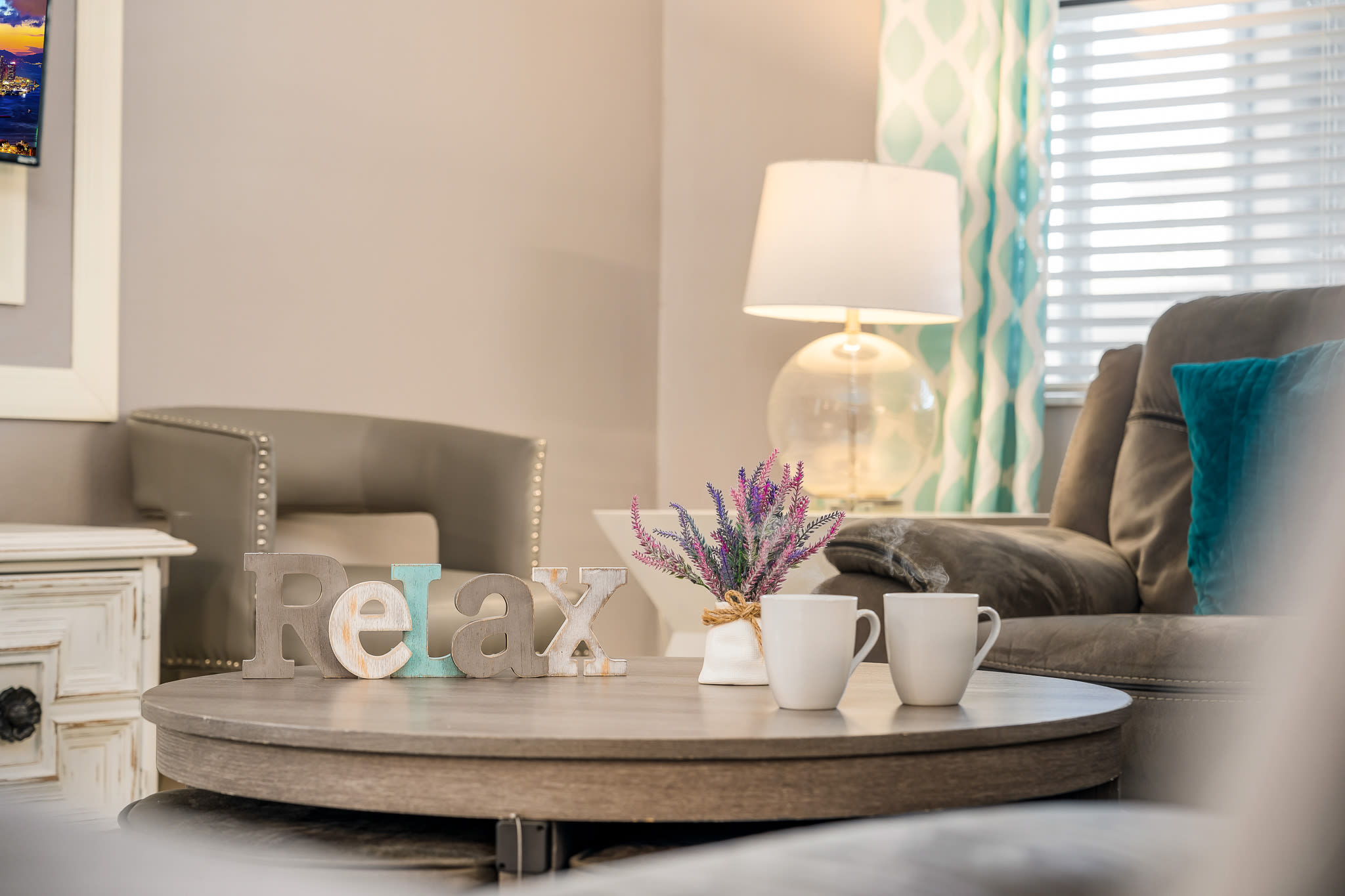 Dining space styled w/ neutral tones and simple decor.