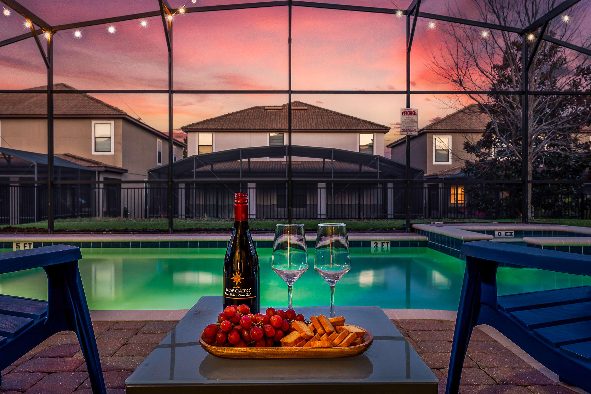 Evening pool scene w/ glowing water and a peaceful nighttime vibe.