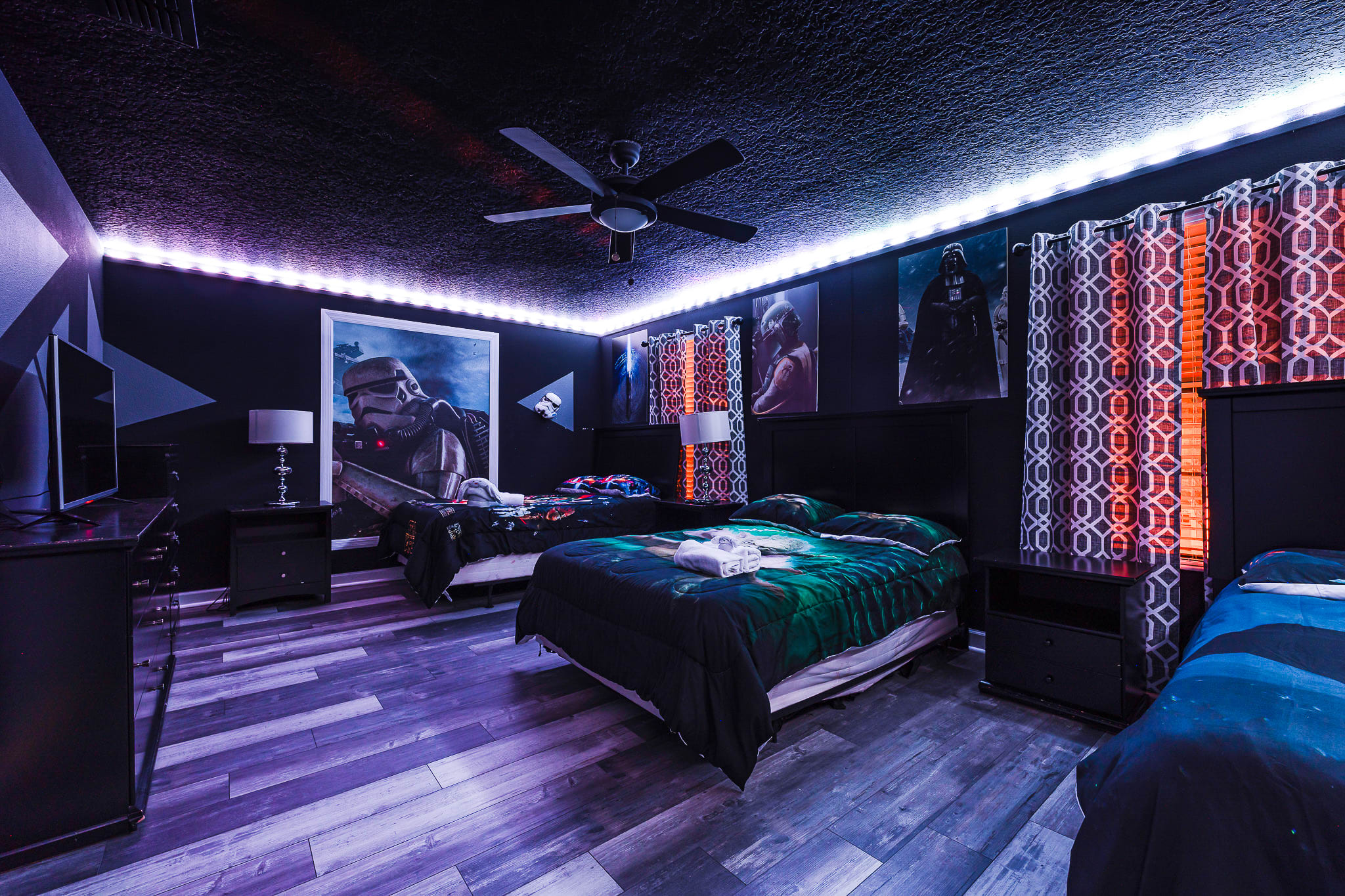 Immersive entertainment room w/ dramatic lighting for movie or game nights.