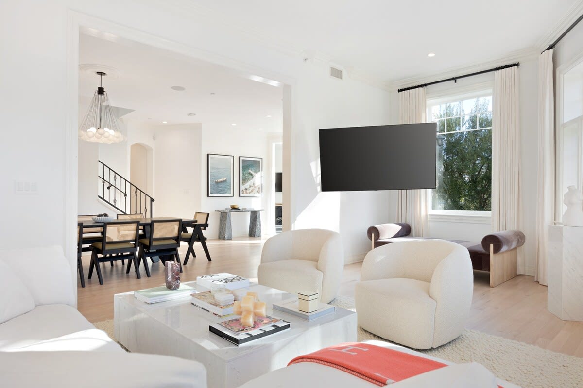 The living room faces a large Smart TV