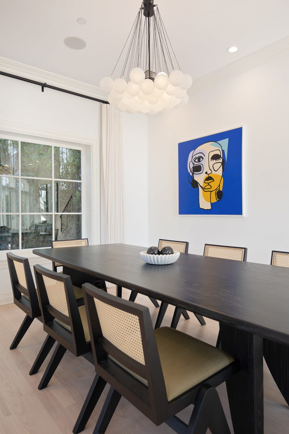 Featuring a large wooden dining table