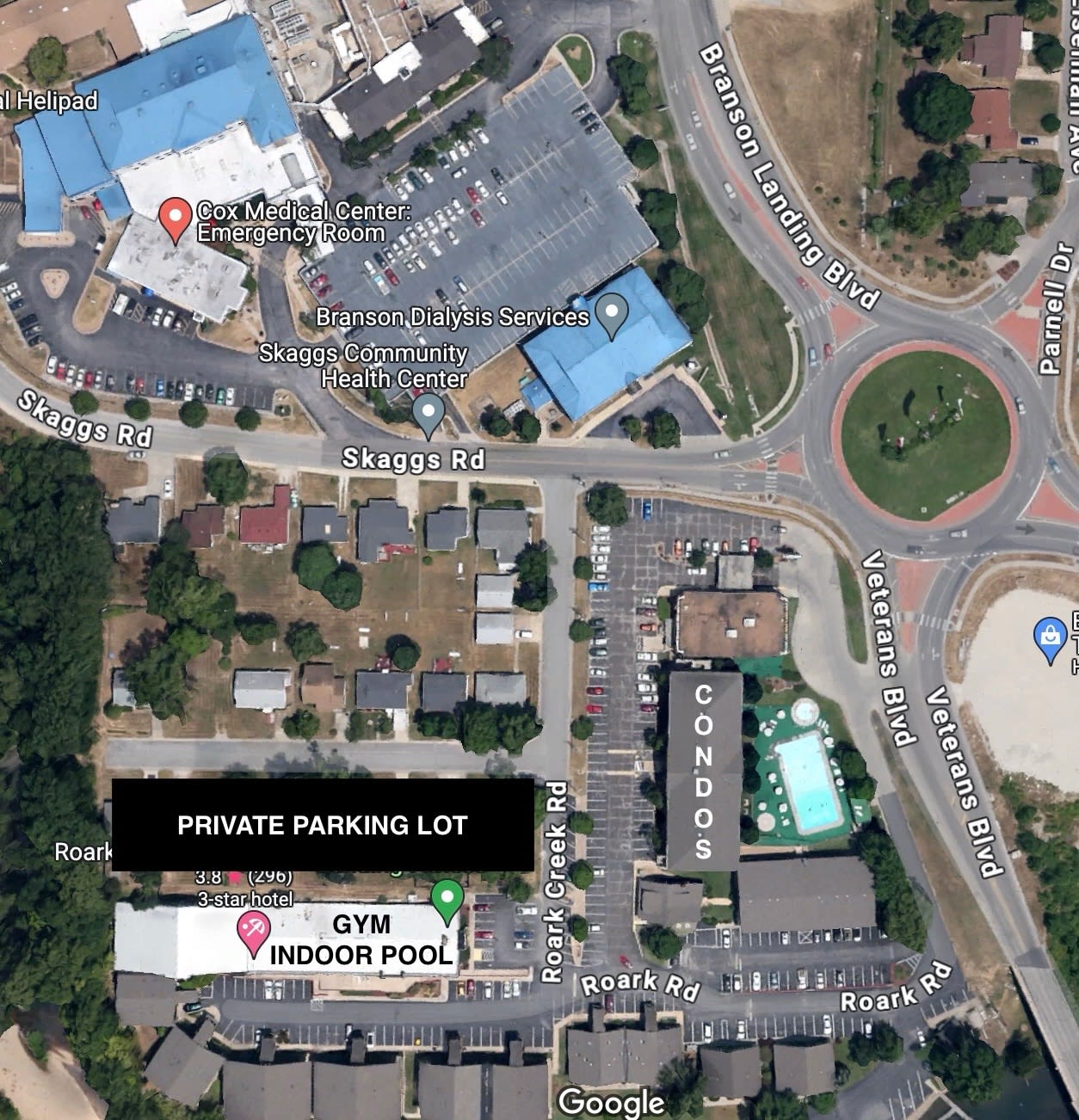 Overview of the property including Condos, Gym, Indoor pool, Cox Medical and roundabout
