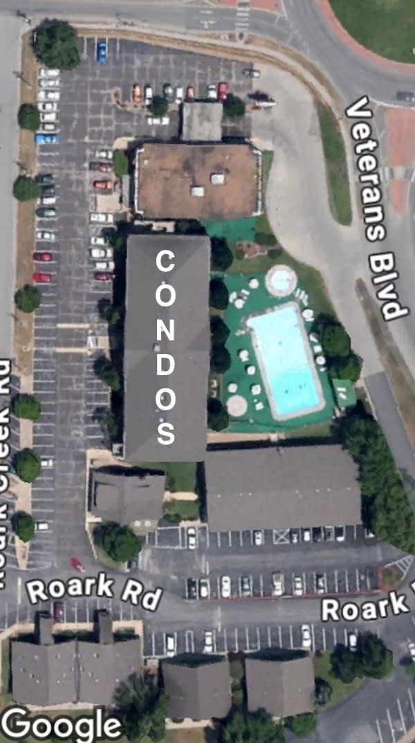 Orient yourself with this overview of the property, including condos, gym, indoor pool, Cox Medical, and roundabout.