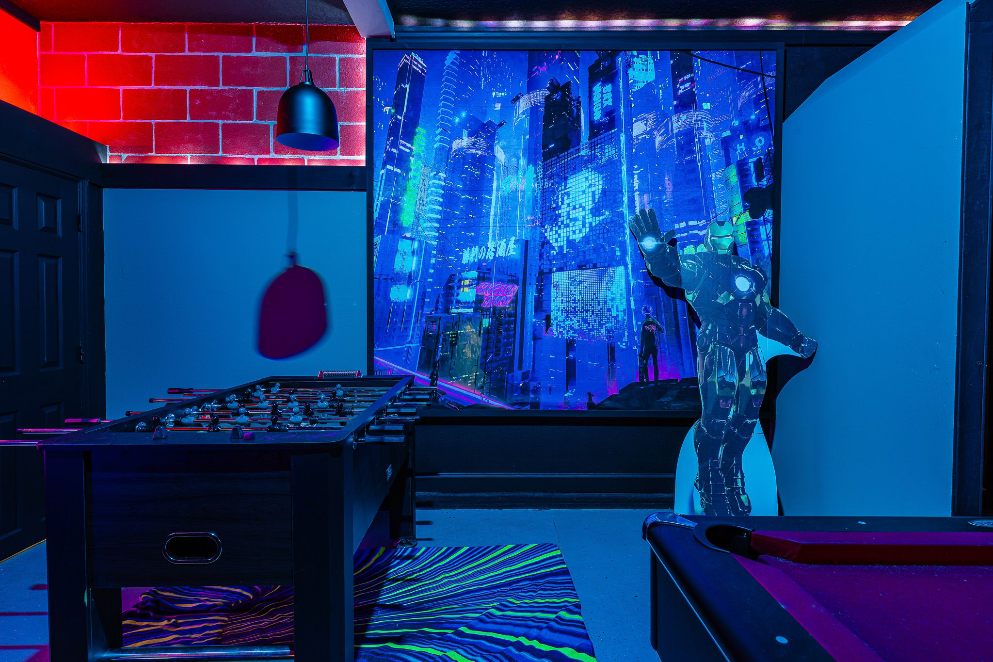 Colorful gaming space featuring bold wall art and vibrant ambient lighting.