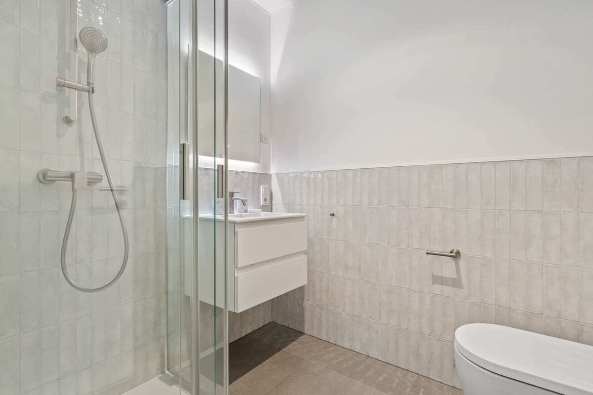 Modern bathroom with walk-in shower for a refreshing start to your day.