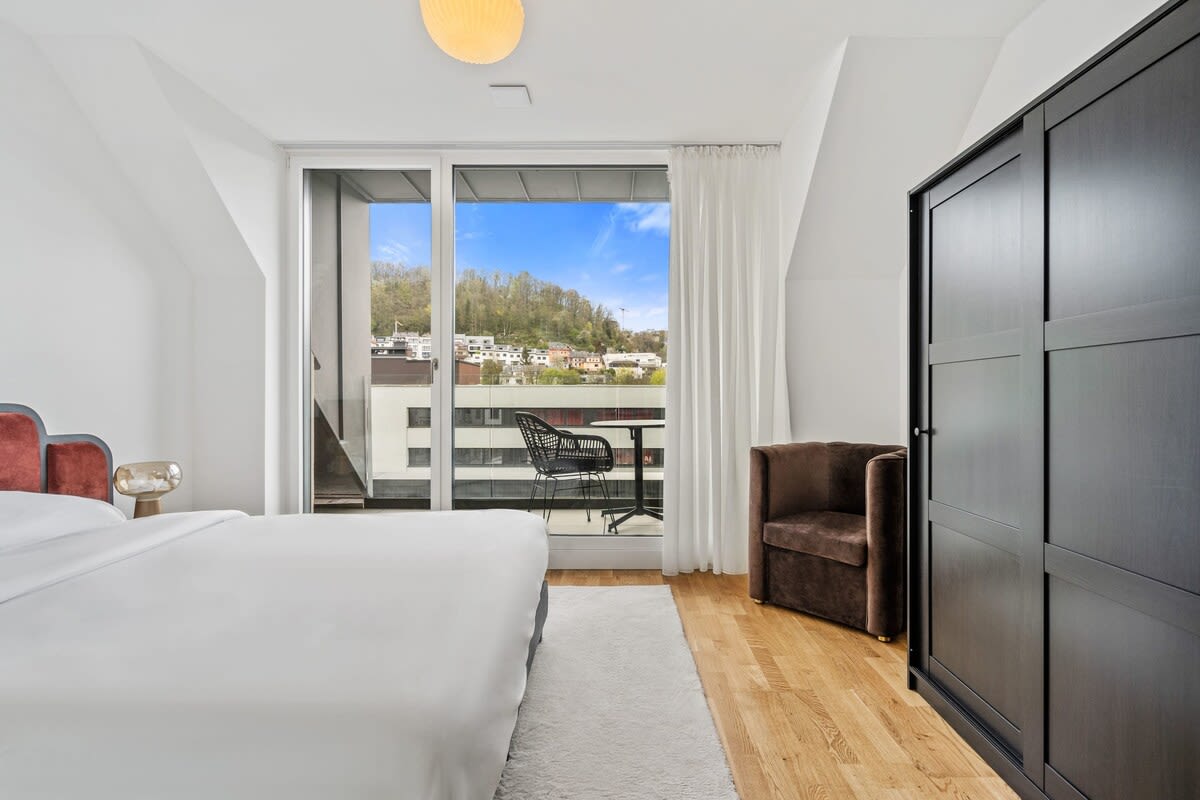 Comfort meets style in this warm, well-appointed bedroom.