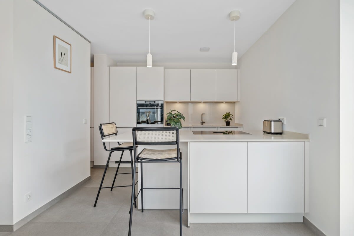 Elegant minimalism in a kitchen that caters to your every need.