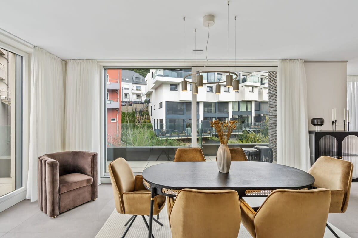 Chic dining area with plush seating, perfect for intimate dinners and social brunches.