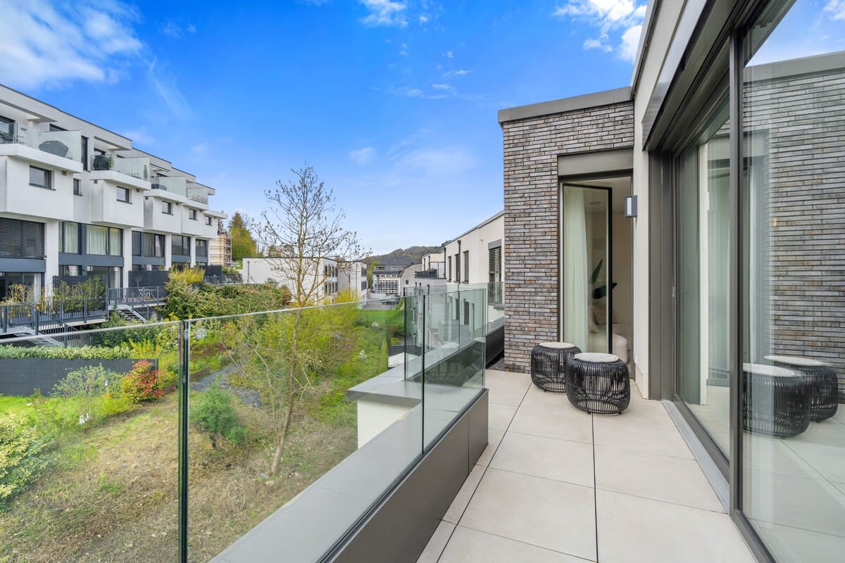 Step out to the balcony for a breath of fresh air and a view of the tranquil surroundings.