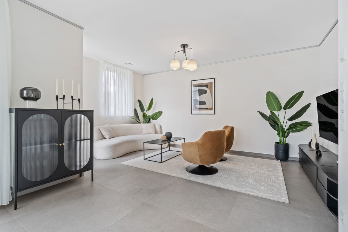 Elegant living area that blends modern decor with homely warmth.