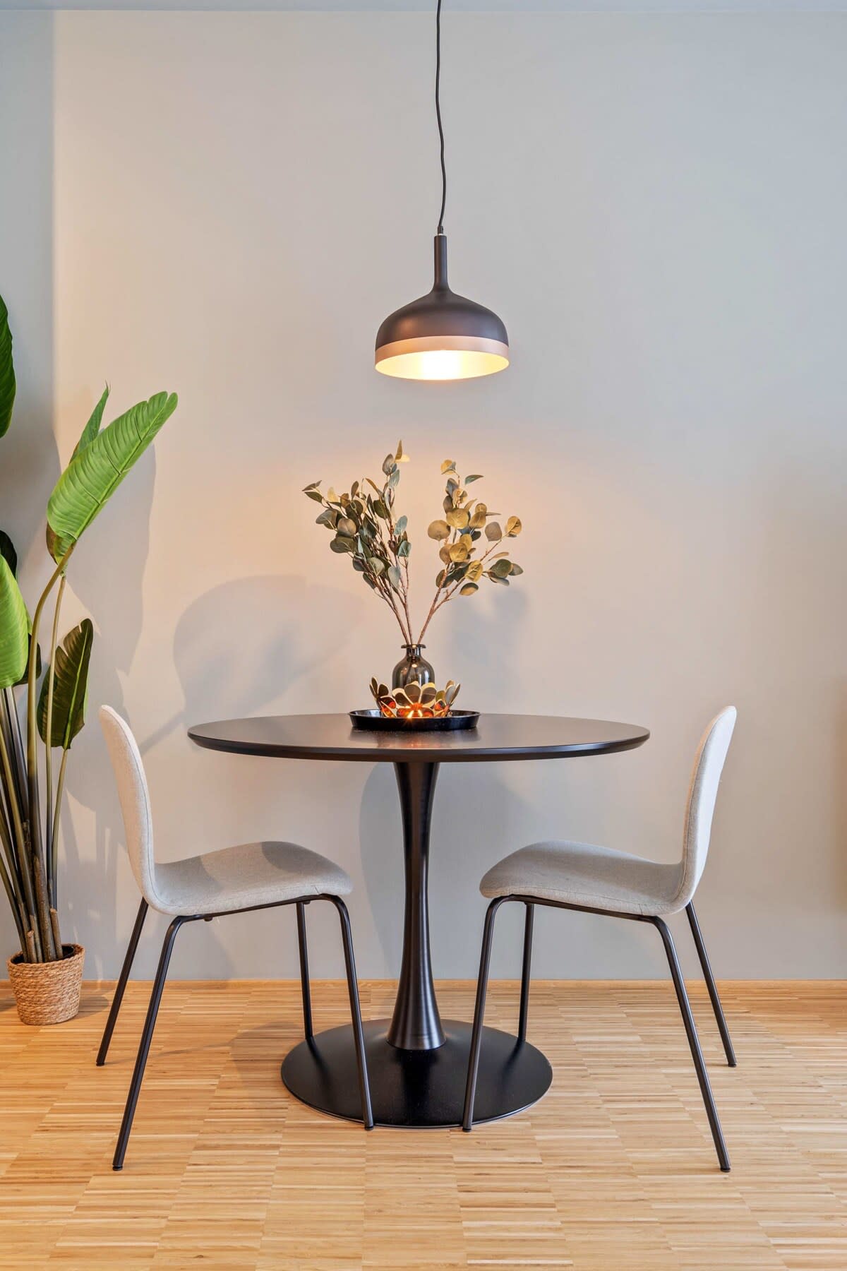 Intimate table for two, perfect for quiet conversations or solo musings.