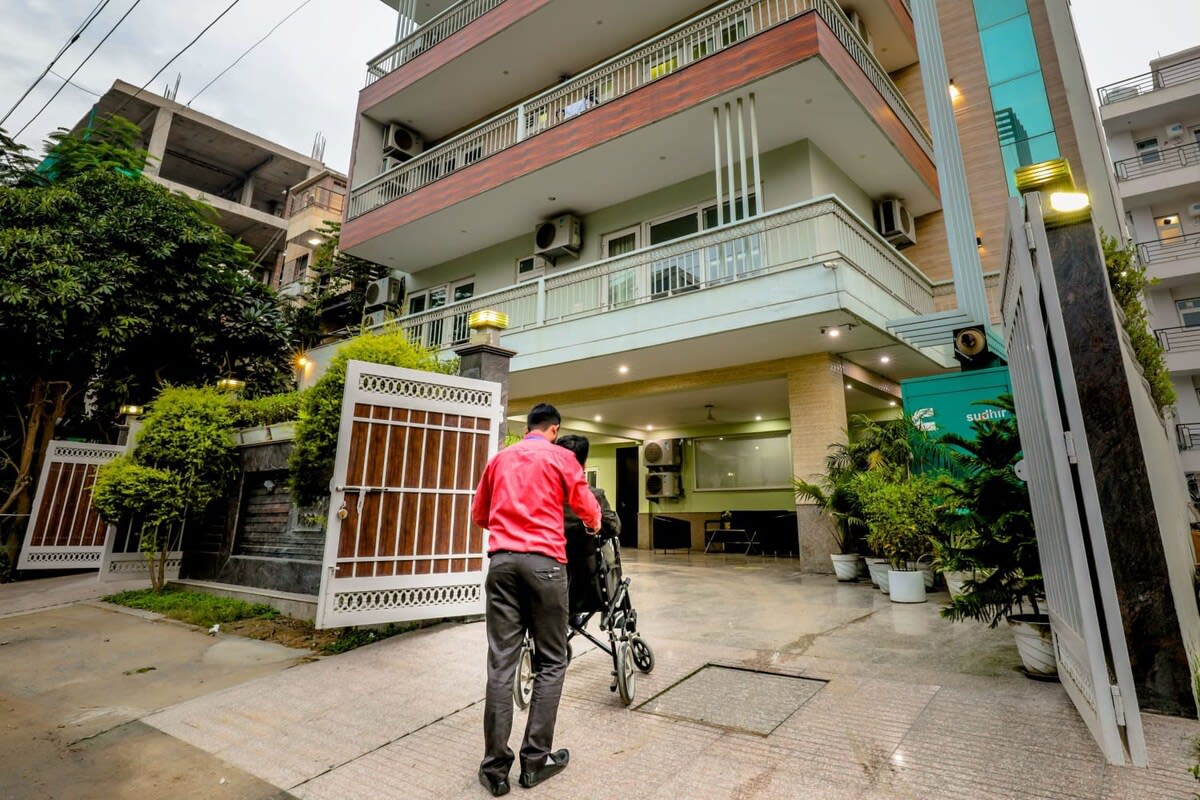 A panoramic view of the exterior of the building, showcasing its architectural design and surroundings -parfait street