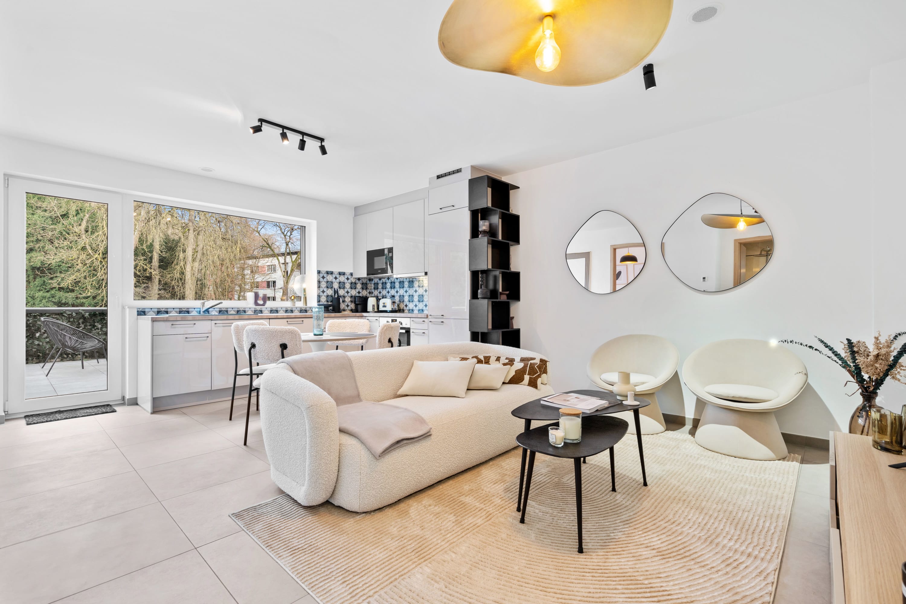 Chic & cozy lounge space with a touch of modern decor and natural light.