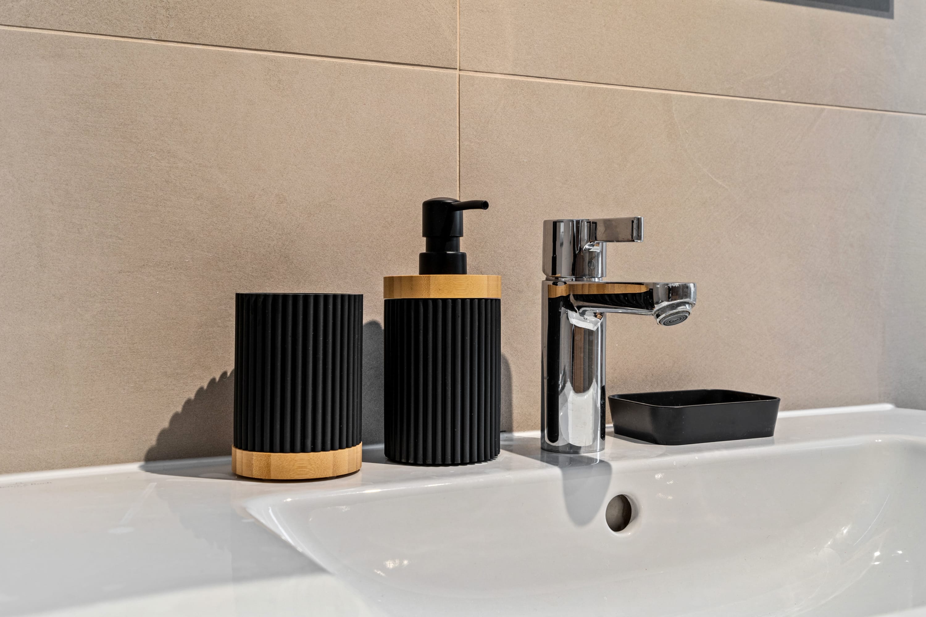 Modern amenities meet serene design in this elegant bathroom oasis.