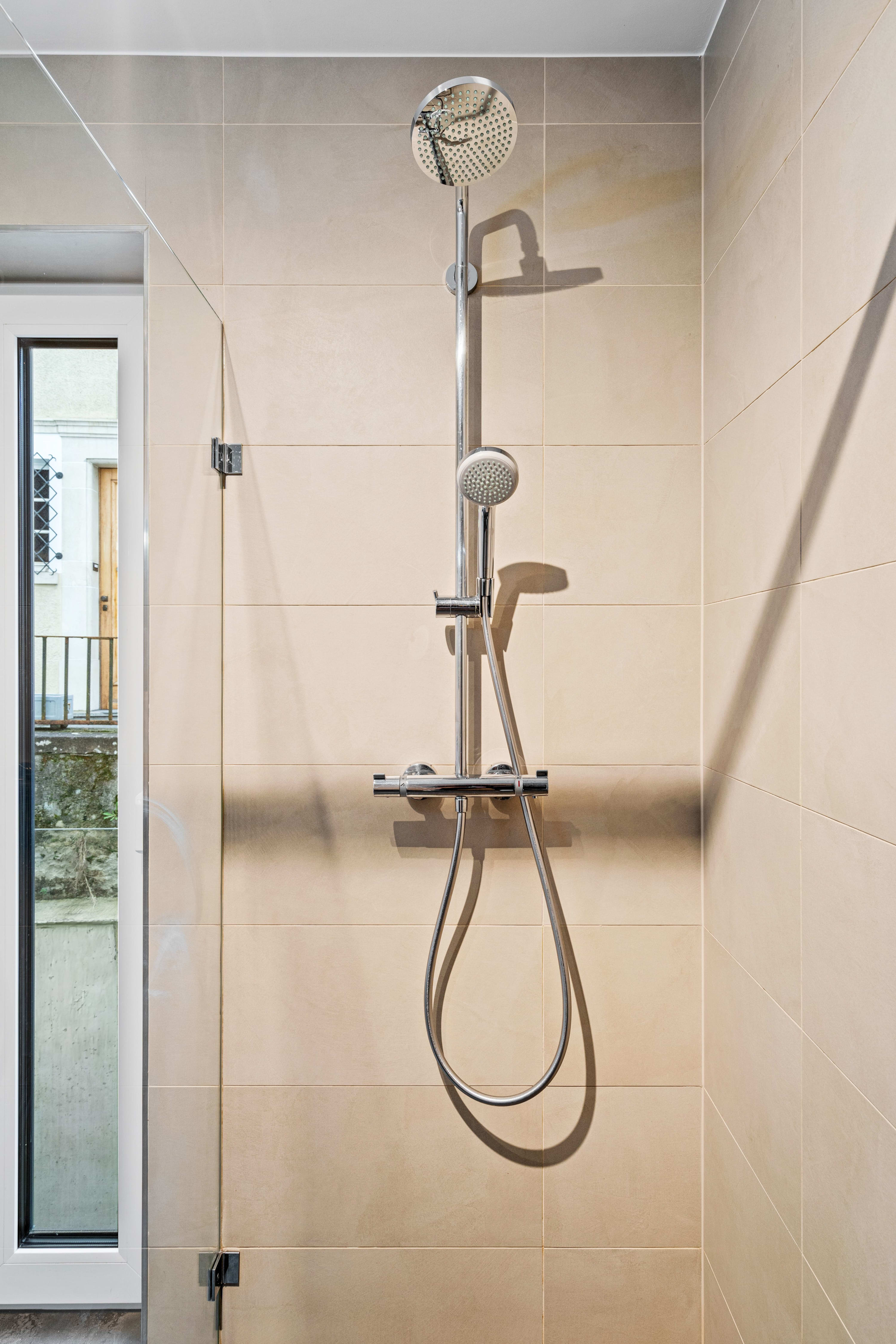 Refresh and rejuvenate in our sleek bathroom with a spacious walk-in shower.