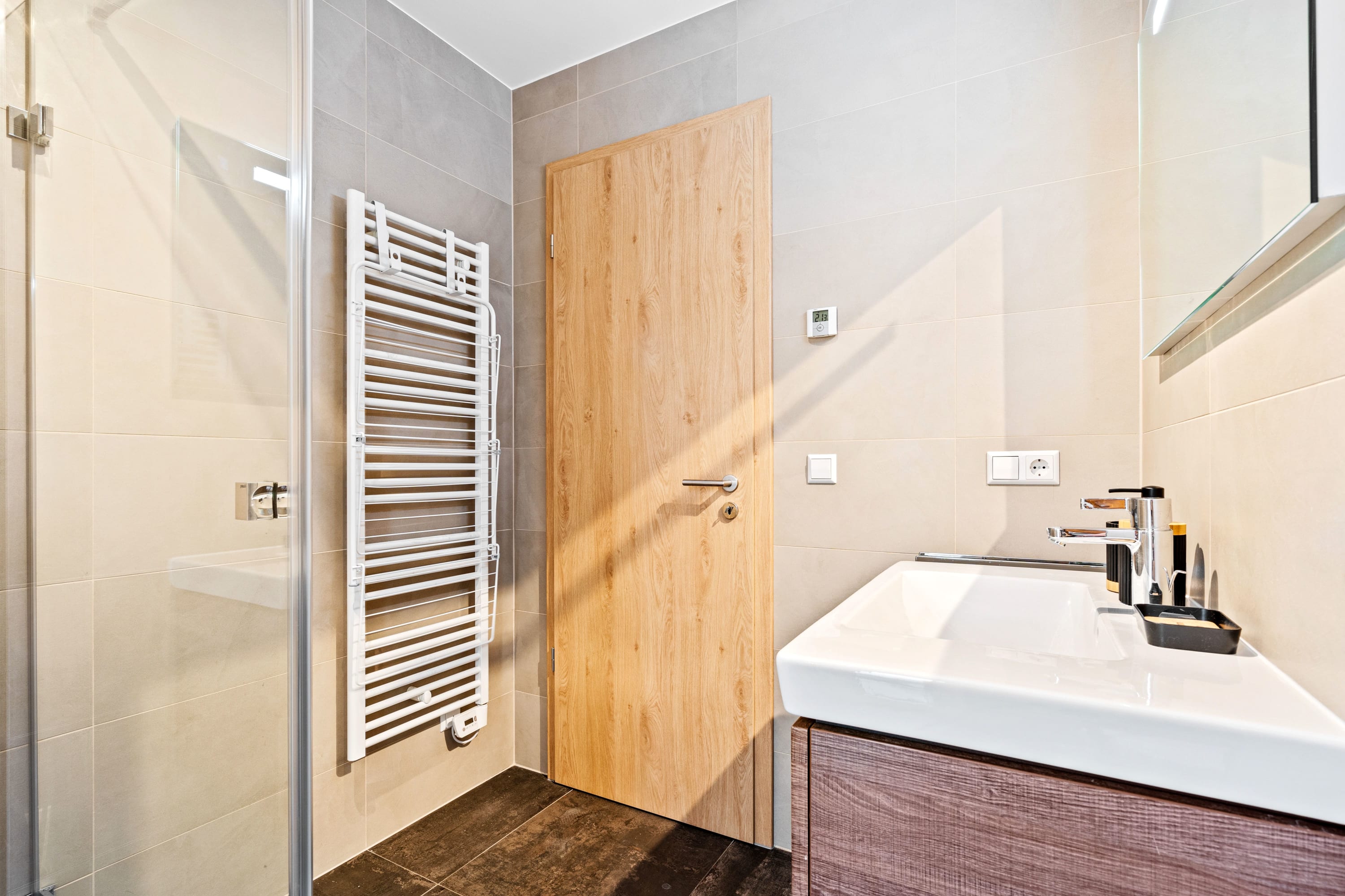 Artistic touches grace our well-appointed powder room for your comfort.