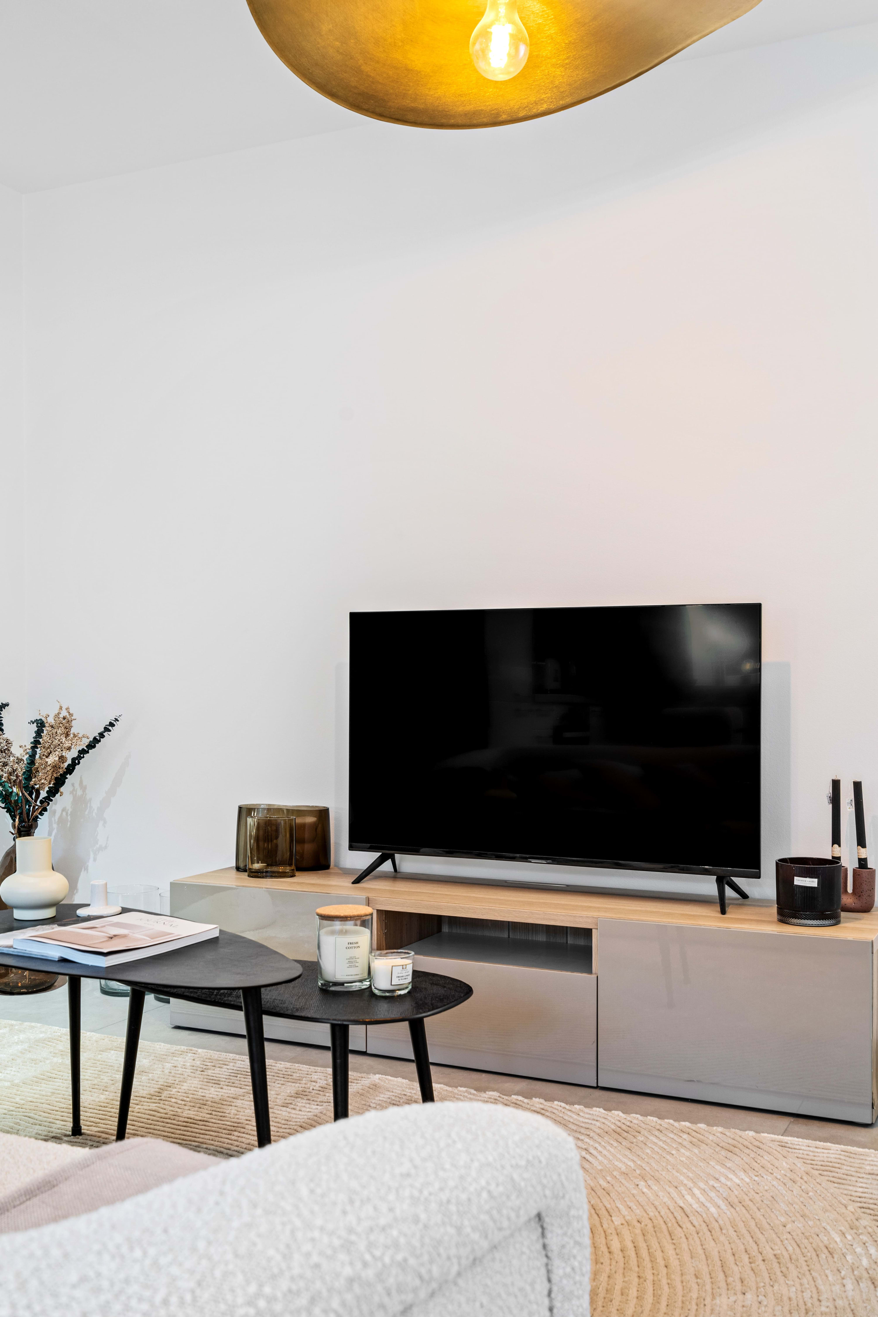 Experience home comforts with our plush seating and state-of-the-art TV.