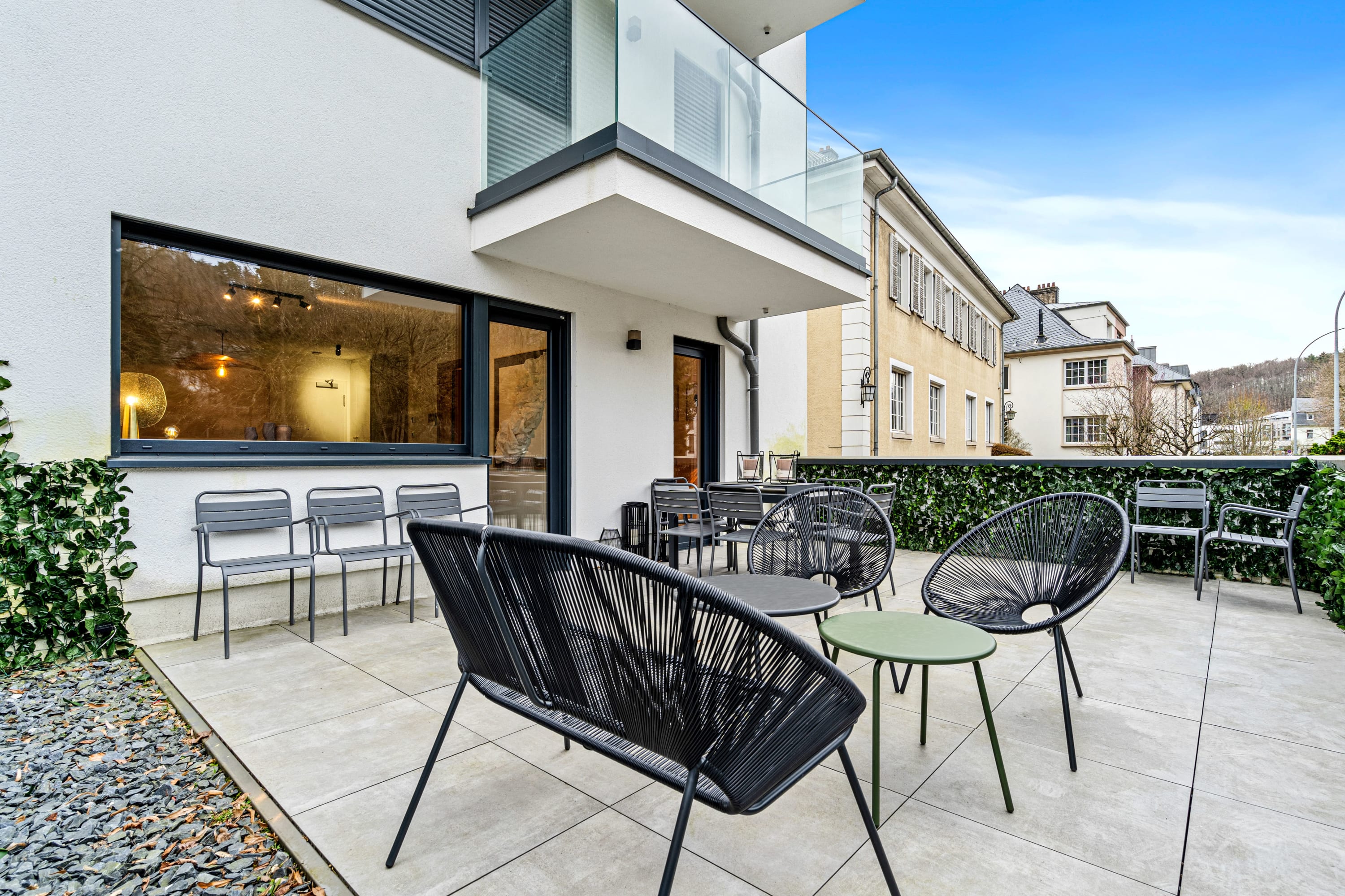 Sip coffee amidst the fresh air and green views.