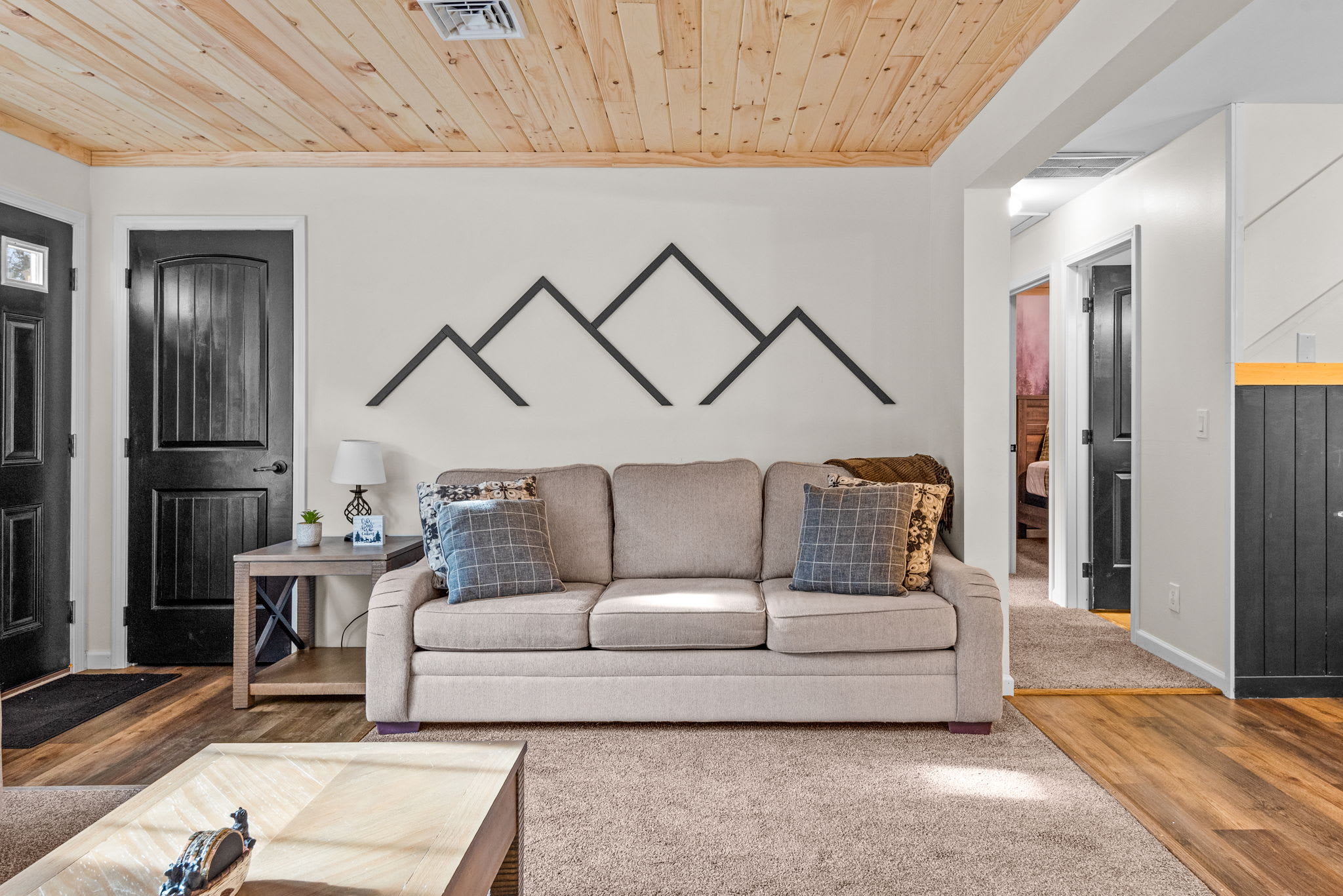 A blend of rustic charm and modern simplicity, this living space features warm tones, thoughtful decor, and plenty of room to unwind.