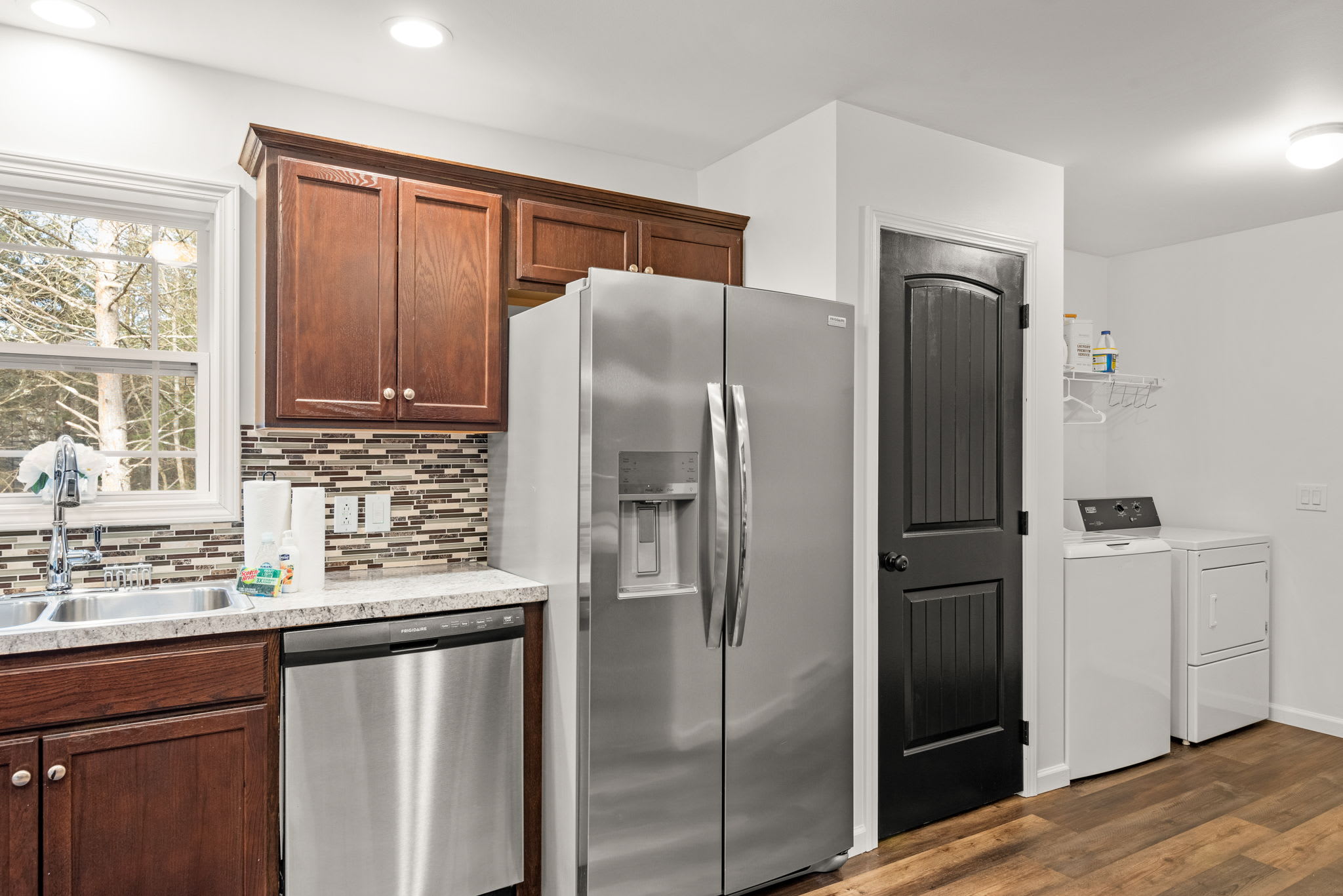 Modern Kitchen Essentials
With a double-door fridge, dishwasher, and ample counter space, this kitchen is designed to be as practical as it is inviting.