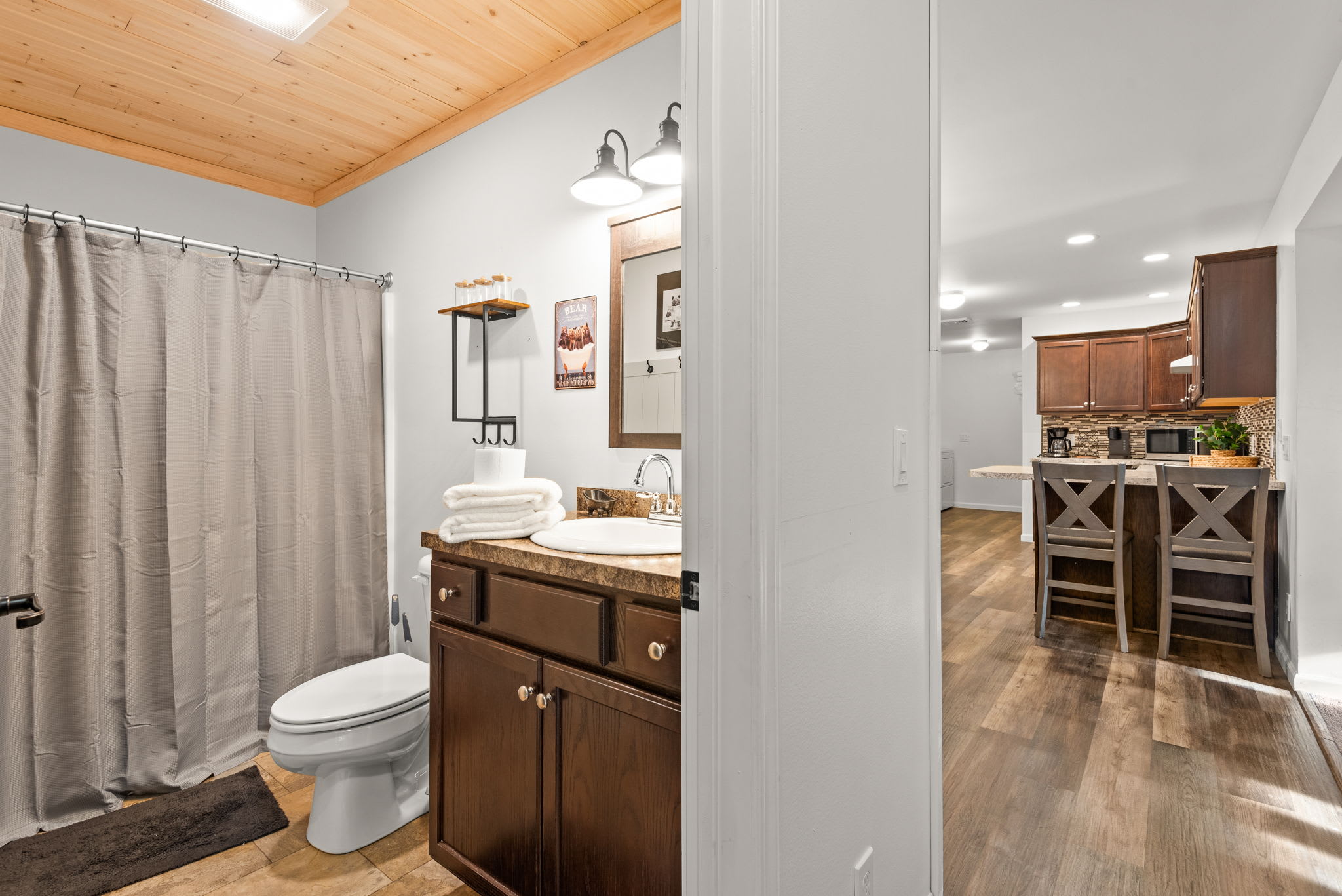 Cozy Full Bathroom with Cabin Charm
A well-appointed bathroom with wood accents, warm lighting, and everything you need to refresh and recharge during your stay.