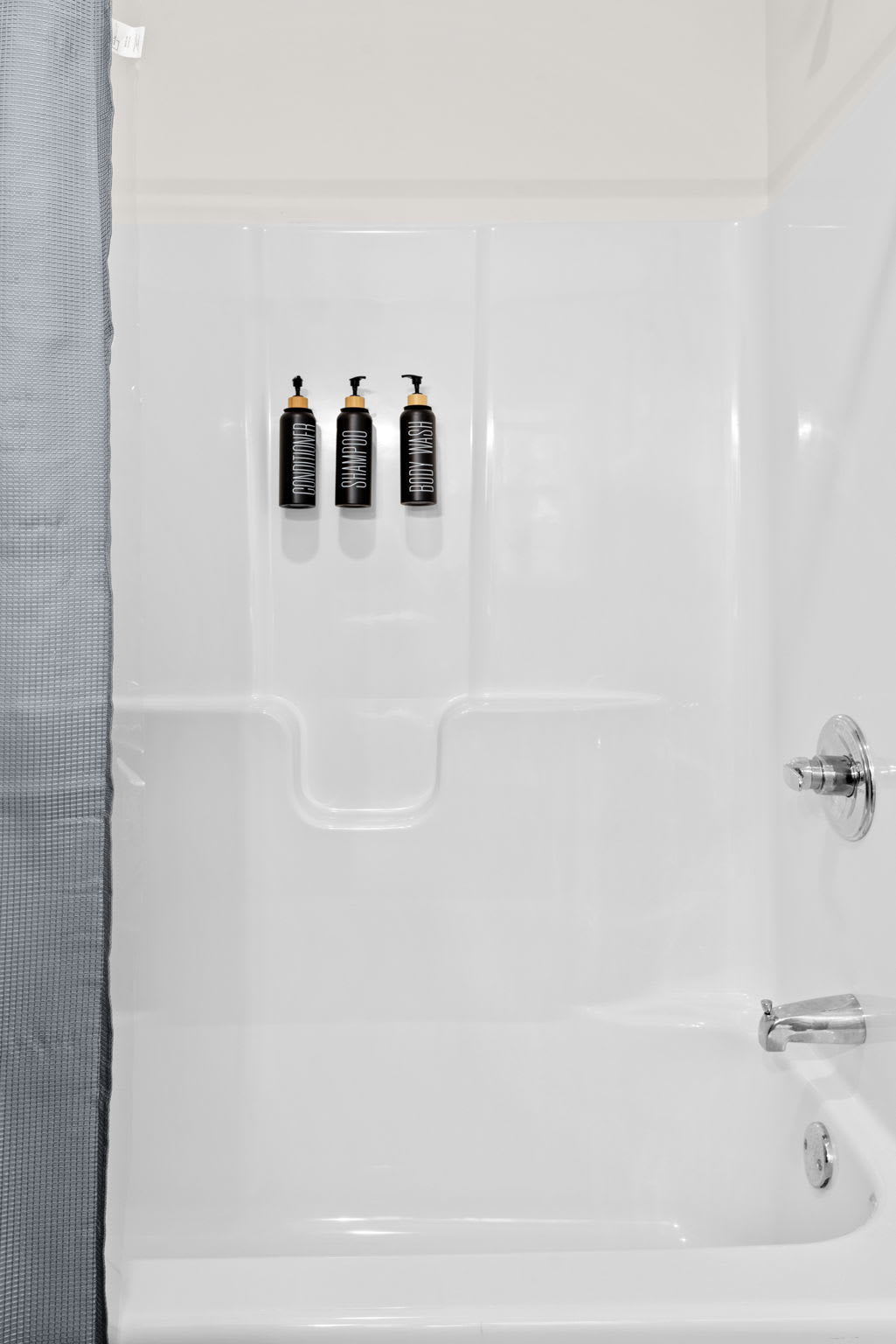 A sparkling clean tub/shower combo with convenient built-in shelving, plus quality body wash, shampoo, and conditioner already stocked for you.