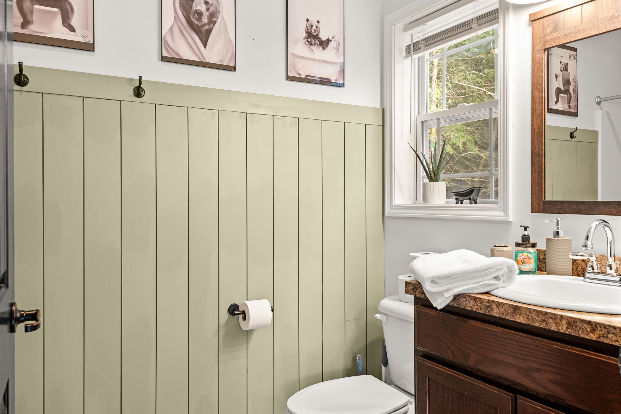 Charming Country-Style Bathroom
Featuring sage green paneling, natural wood accents, and soft lighting, this bathroom brings a warm, rustic charm to your daily routine.