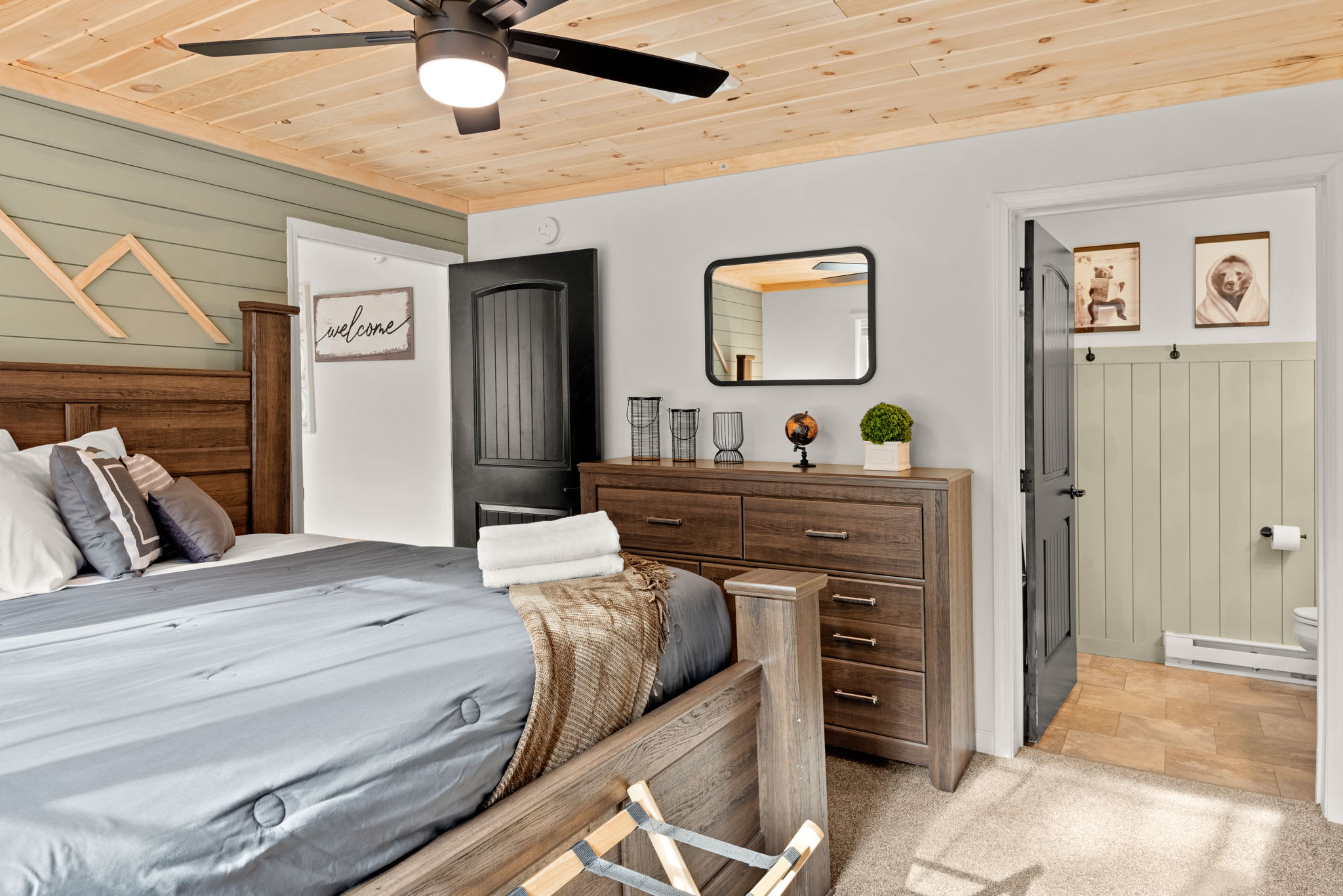 Spacious Master Bedroom Retreat
A beautiful blend of rustic charm and soft modern touches this primary suite features a queen-size bed, cozy seating, and serene wood finishes for a truly restful vibe.