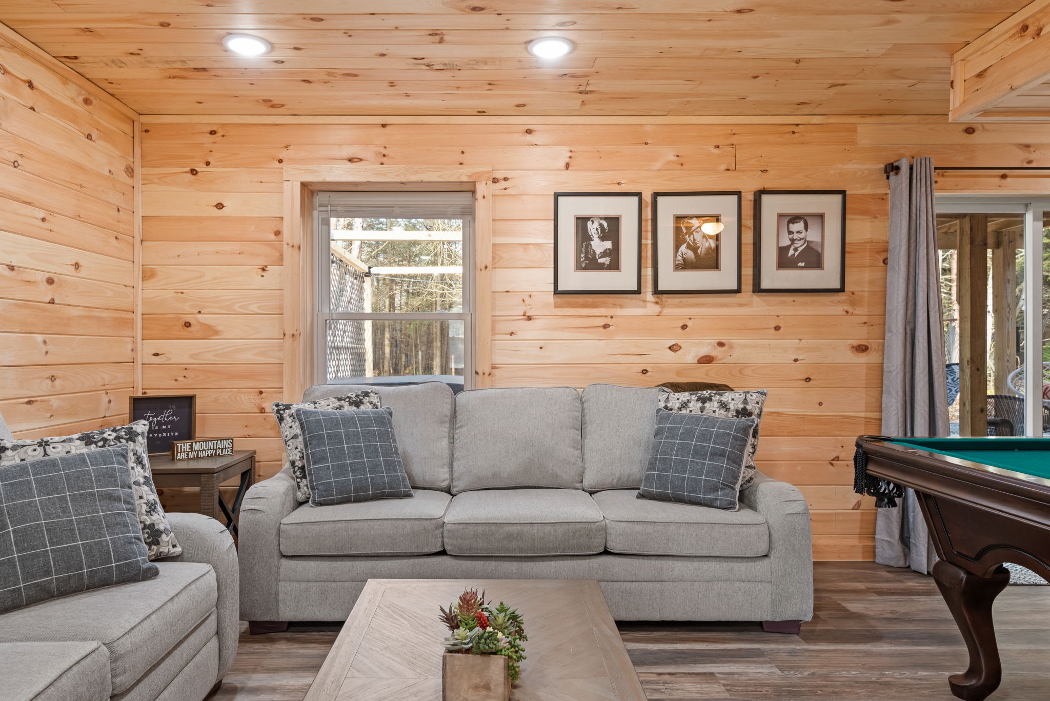 Relax in this inviting lounge area tucked beside the pool table perfect for spectators, card games, or catching your breath between rounds.