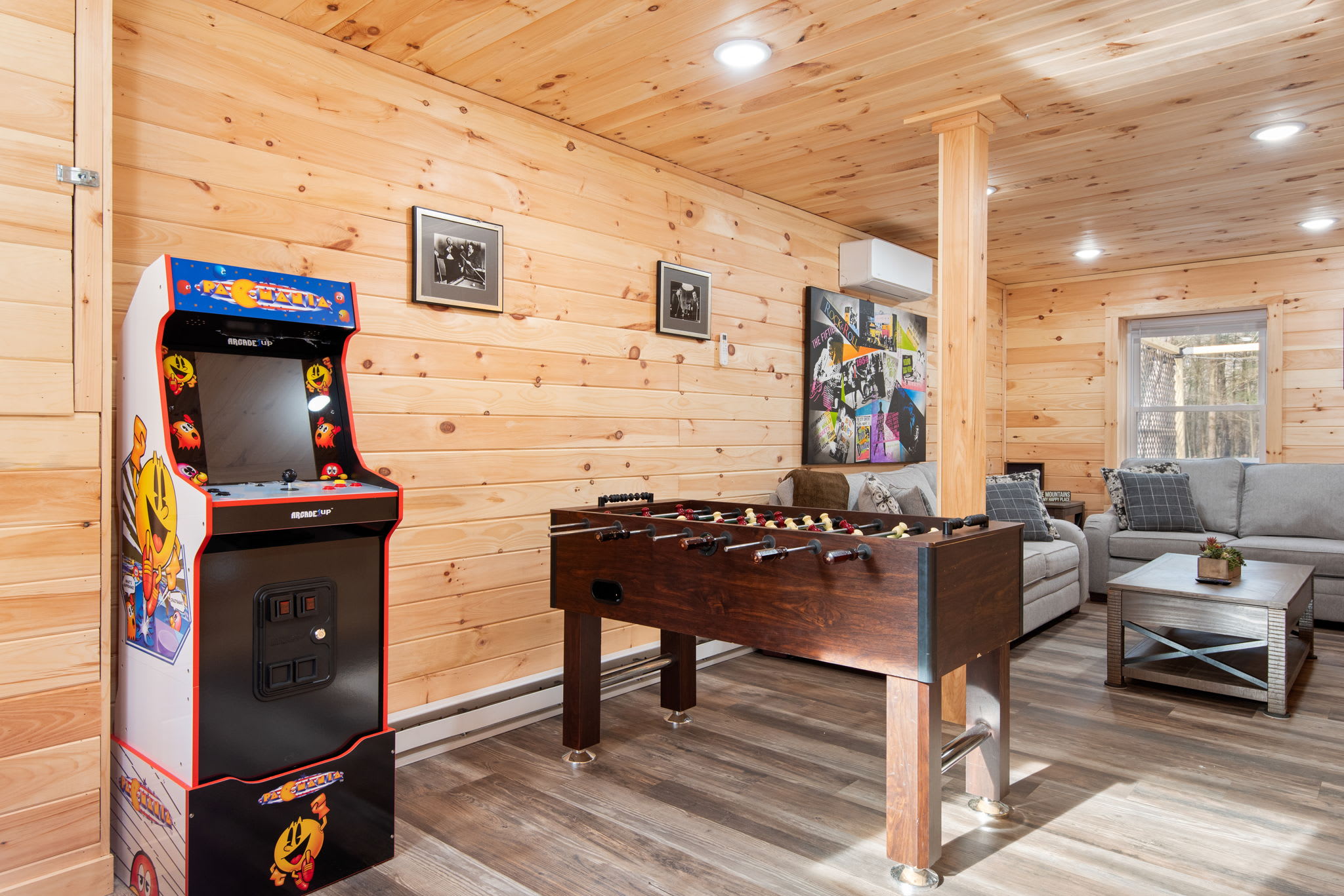 Retro Arcade & Game Room Fun
Let loose in this playful cabin-style game room featuring an arcade machine, foosball, and comfy hangout space perfect for all ages.
