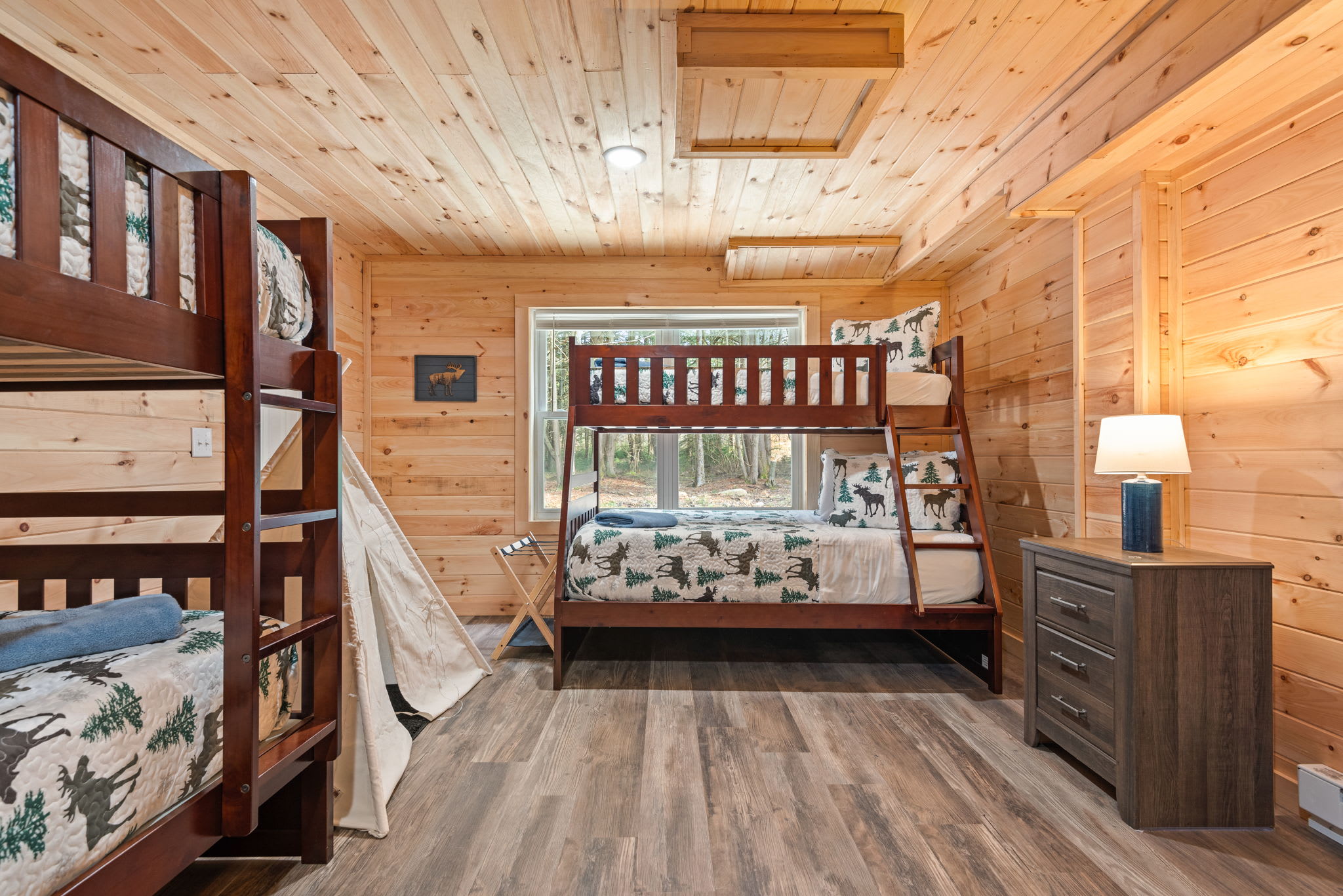 With bunk beds, a reading teepee, and rustic animal-themed bedding, this room is perfect for little explorers to wind down after big days.