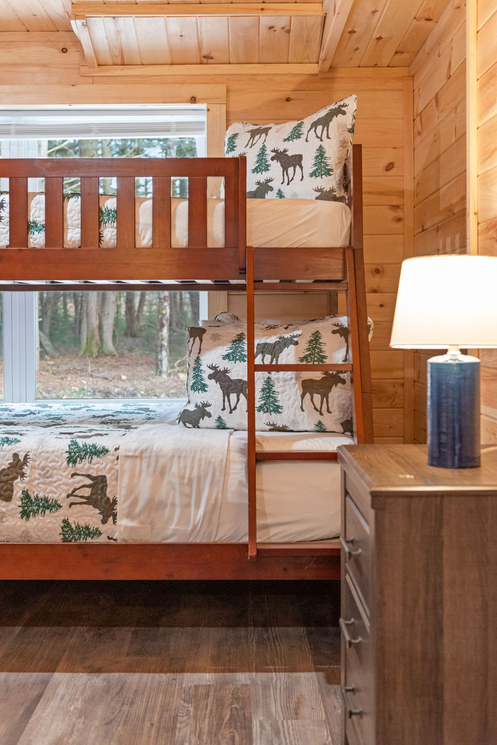 With sturdy bunks, forest-themed decor, and soft lighting, the kids' room keeps things cute, cozy, and ready for adventure.