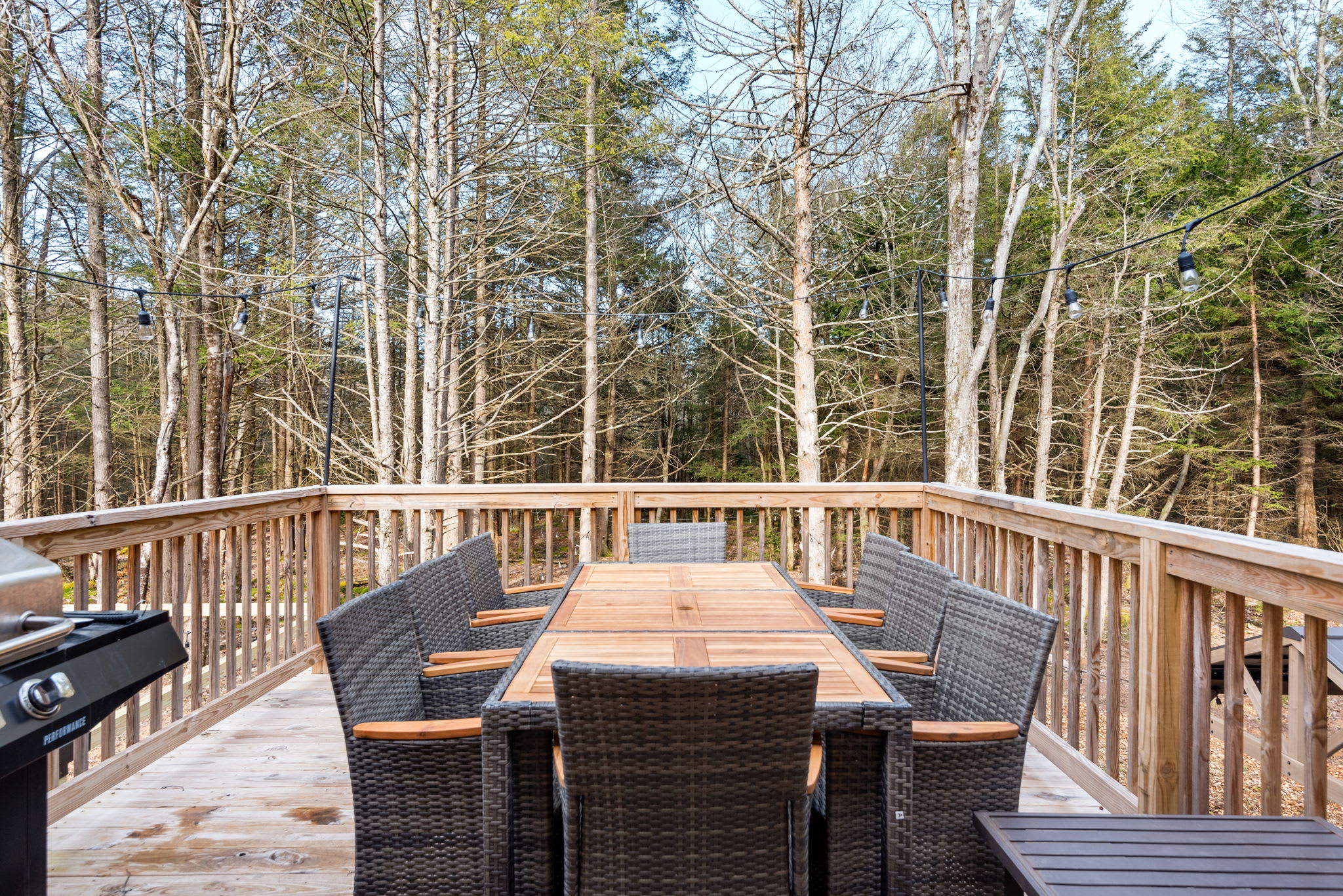 Elevated Forest Views from the Deck
Surrounded by tall trees, this second-level dining area gives you a peaceful, private outdoor experience great for morning coffee or evening wine.