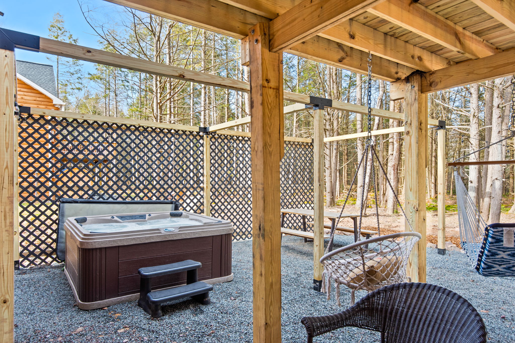 Tucked-Away Hot Tub Hideout
This private, fenced-in hot tub setup brings all the chill. Soak away your stress in total peace with the woods just steps away.