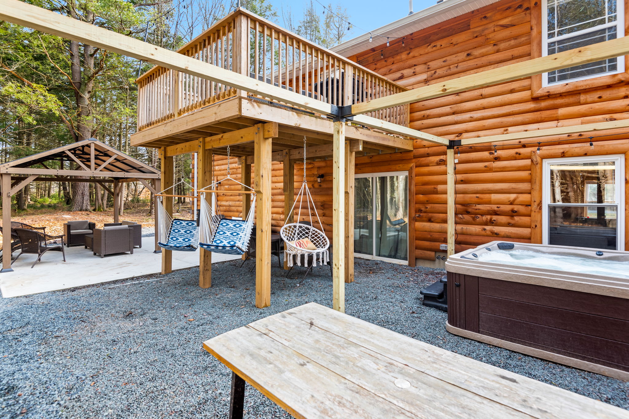 Everything You Need in One Chill Spot
Hammocks, a picnic bench, bubbling hot tub, and rustic privacy this outdoor area has it all for max comfort and laid-back vibes.