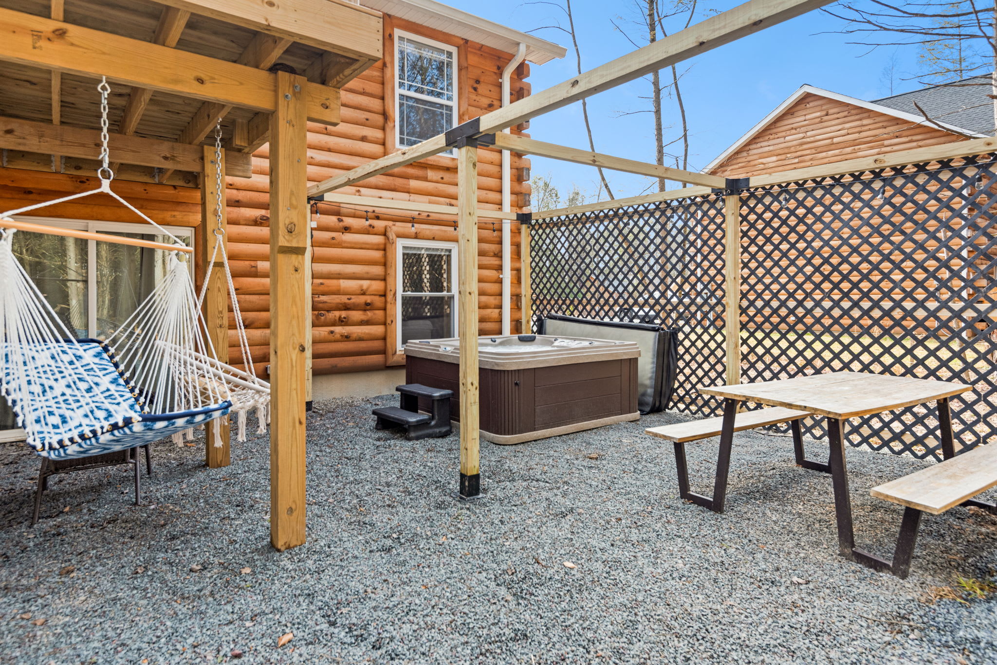 Everything You Need in One Chill Spot
Hammocks, a picnic bench, bubbling hot tub, and rustic privacy this outdoor area has it all for max comfort and laid-back vibes.