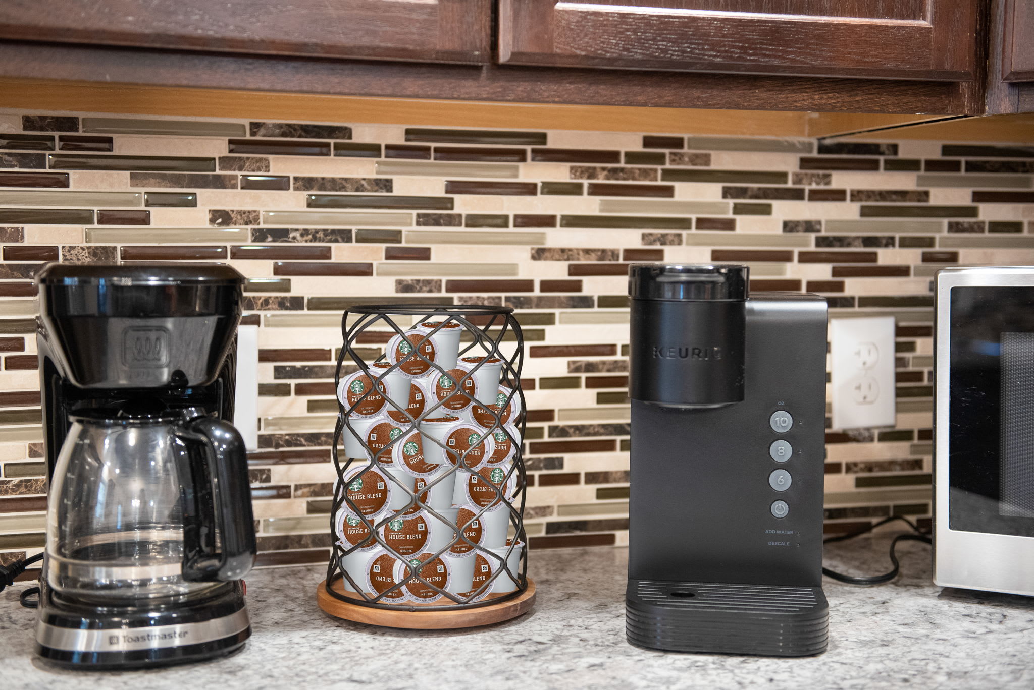 Coffee Station Ready to Go
Start your mornings right with this fully stocked coffee bar featuring both drip and pod brewers plus a stylish carousel of your favorite blends.