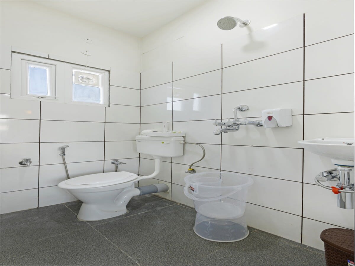 A sleek, modern bathroom with minimalist design and chrome fixtures.