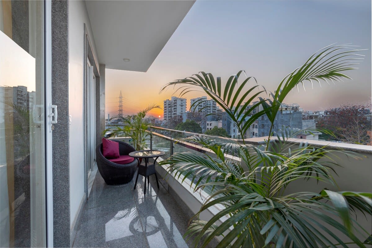 A serene balcony scene with a cup of tea, inviting relaxation and contemplation with a soothing view.