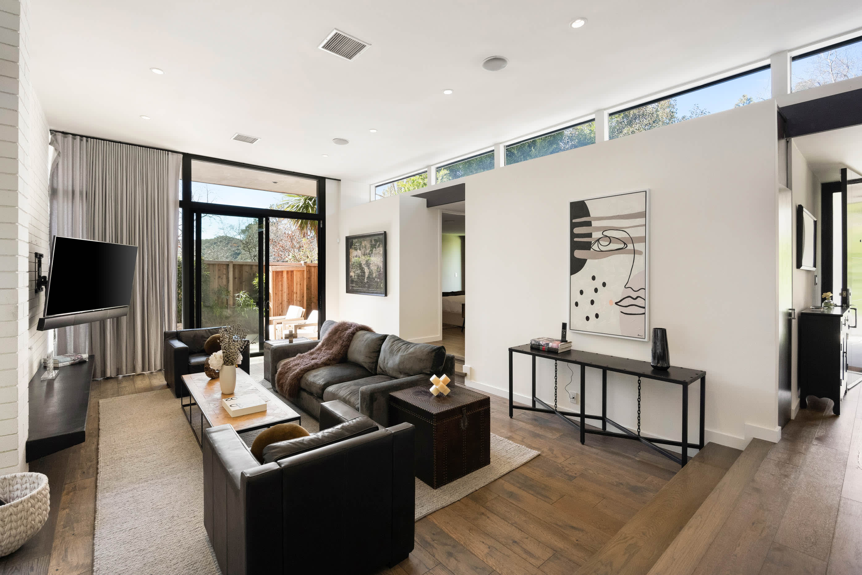 Step into an inviting, light-filled living area, crafted for your relaxation and enjoyment throughout your stay.