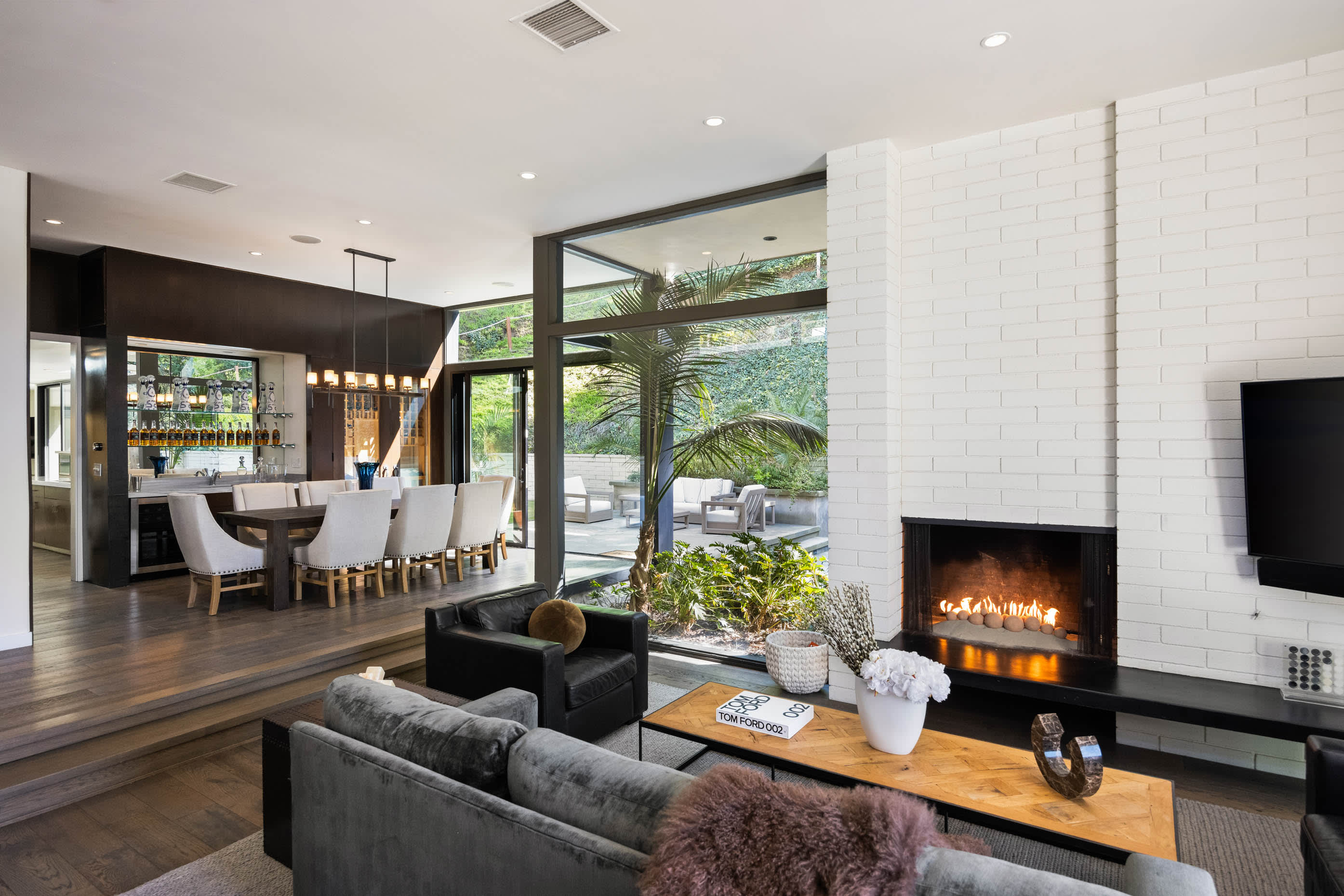 Cozy up by the fireplace, adding warmth and ambiance to the living space for a relaxing evening indoors.