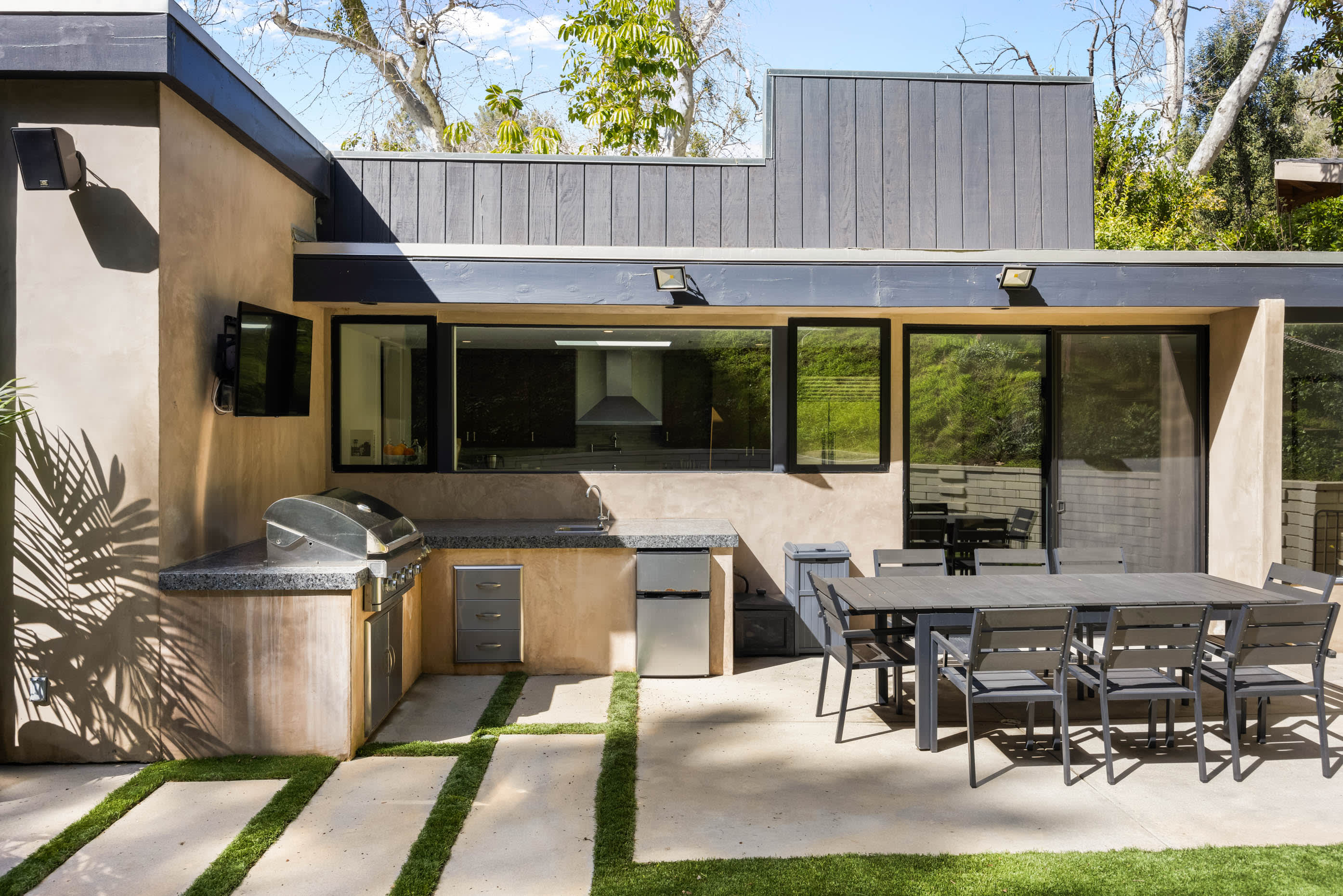Experience outdoor dining at its finest with the BBQ grill in the outdoor seating area.