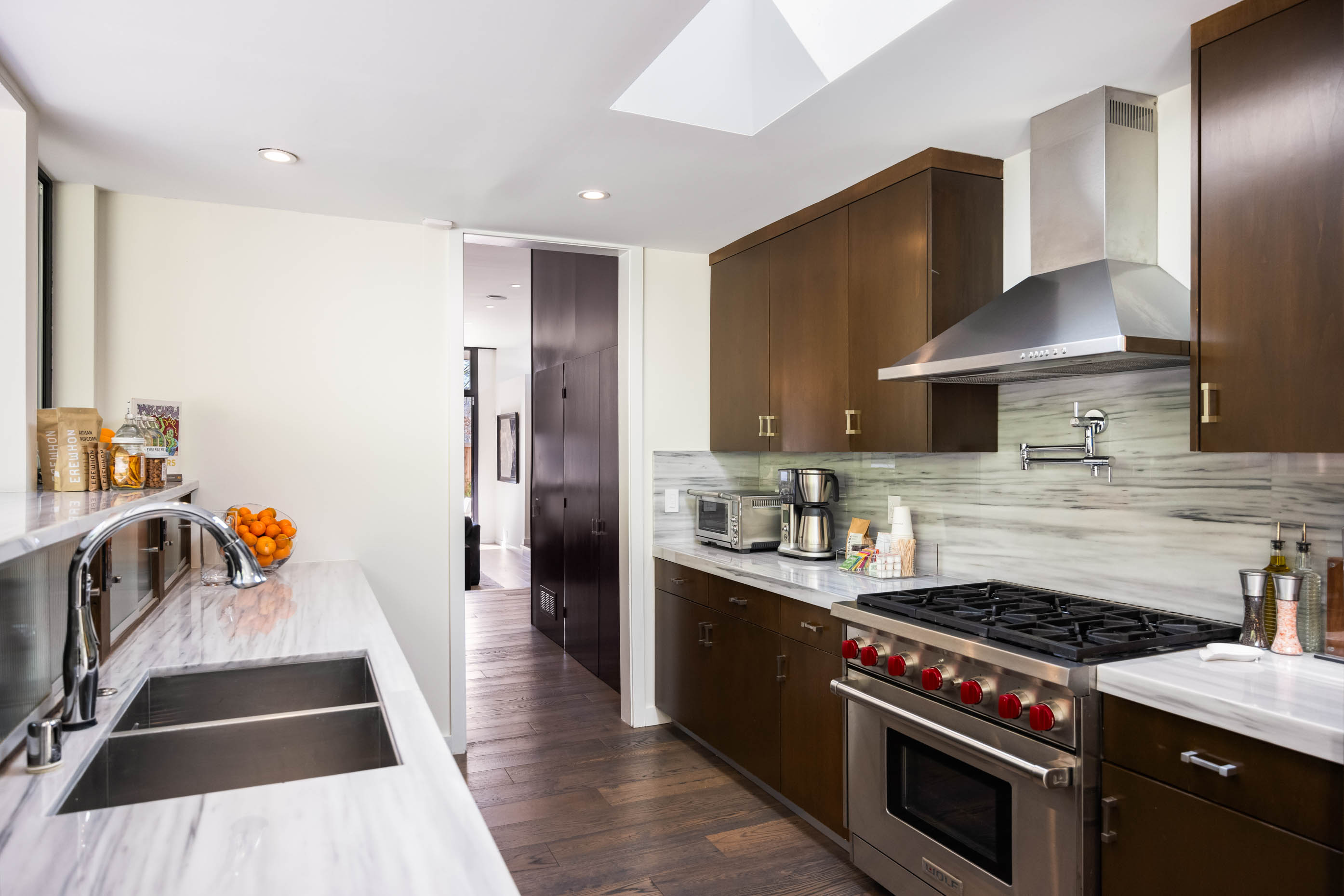 Equipped with essential amenities like bowls, pots and pans, oil, salt, and pepper.